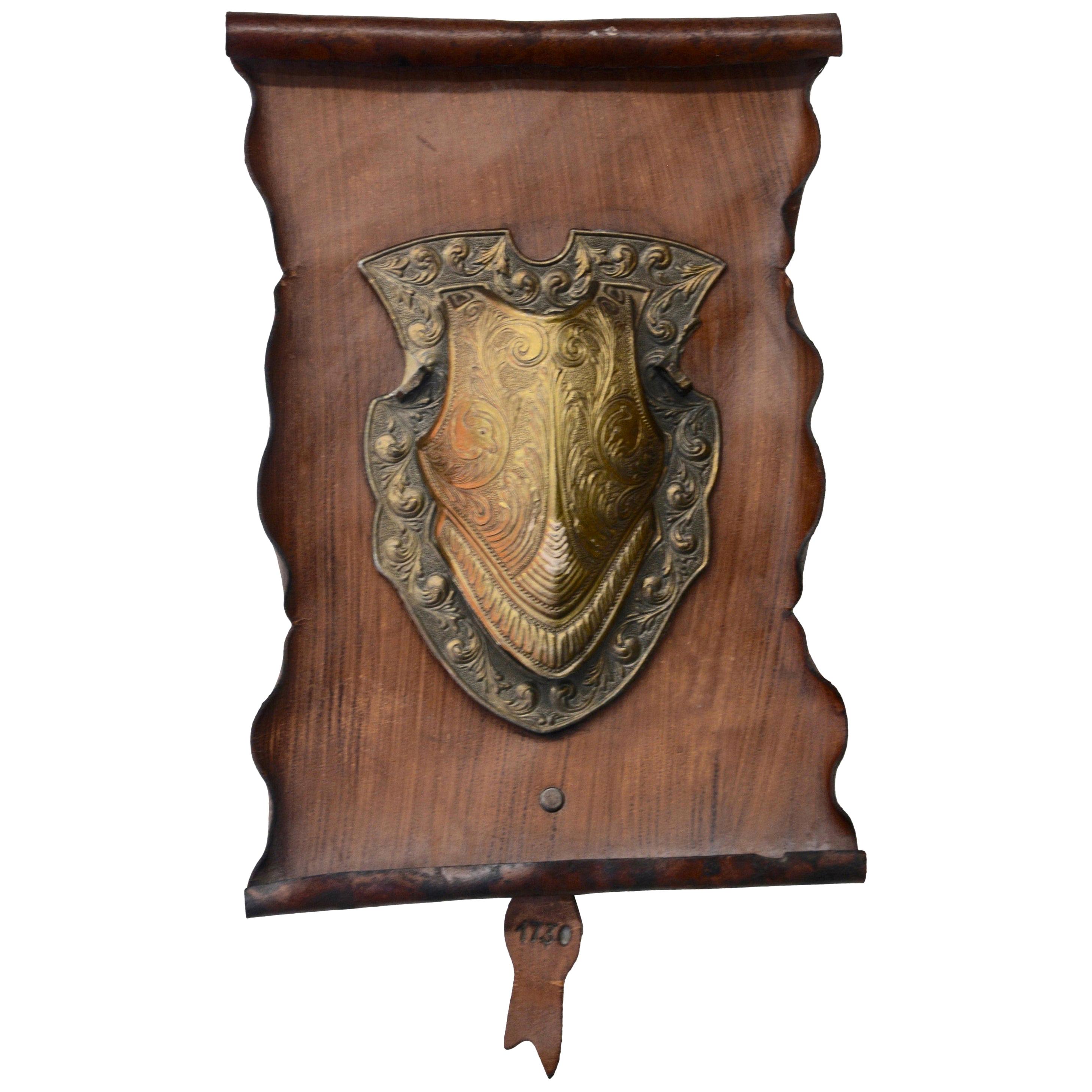 Bronze Shield on Rustic Leather Scroll Wall Hanging For Sale