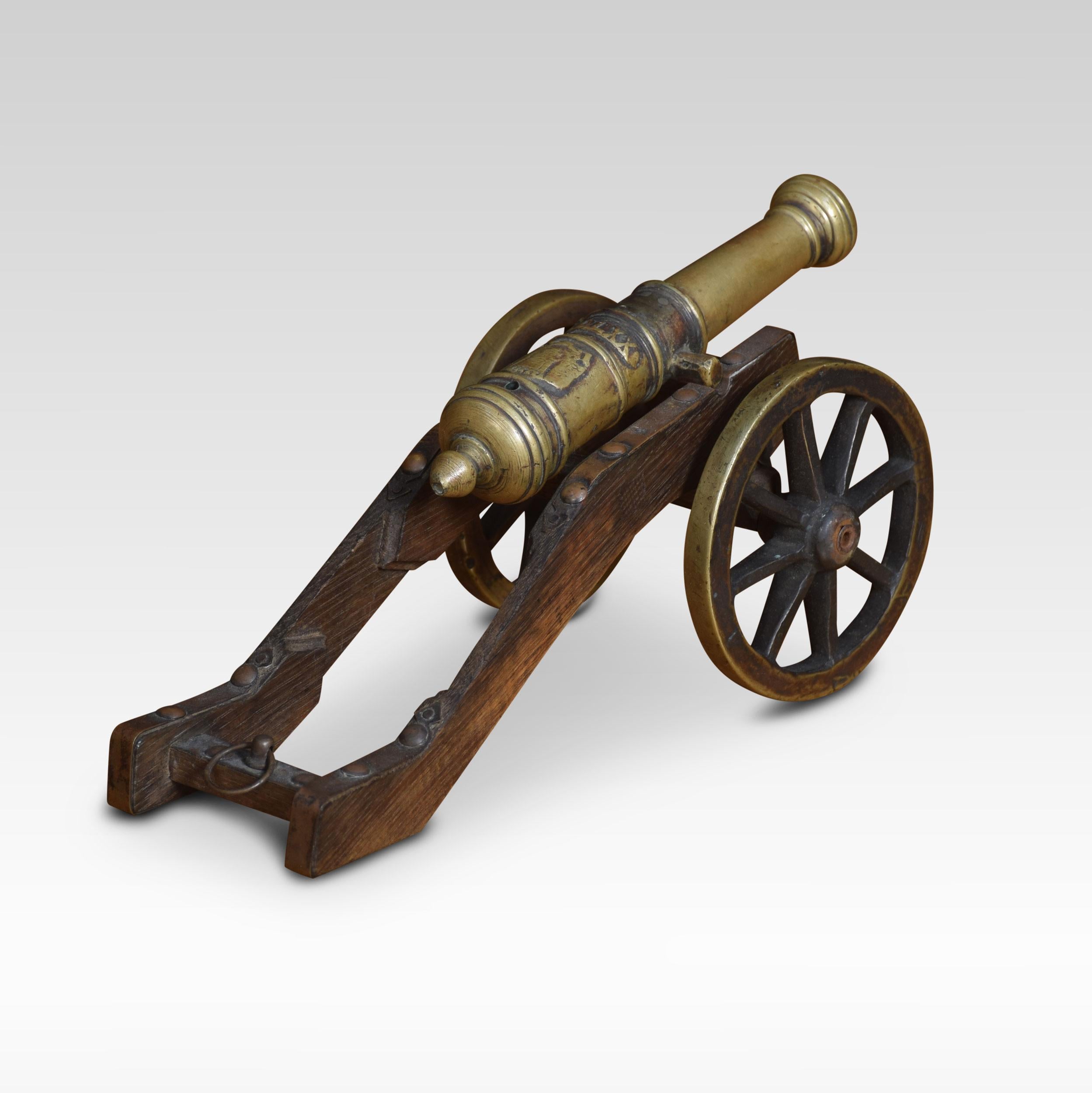 Signal cannon with a bronze barrel mounted on a wooden carriage with spoked wheels. Barrel length 7.5 inches
Dimensions
Height 5.5 inches
Width 5 inches
Depth 11 inches.