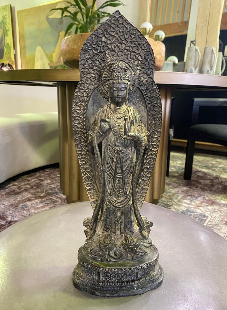 A wonderful standing bronze statue of Buddha Guanyin, the Bodhisattva of compassion and mercy. The work exhibits fine detail, a lovely composition, and a beautiful aged patina. 

Signed/Stamped on the base by the artist/ maker. 

Would be a