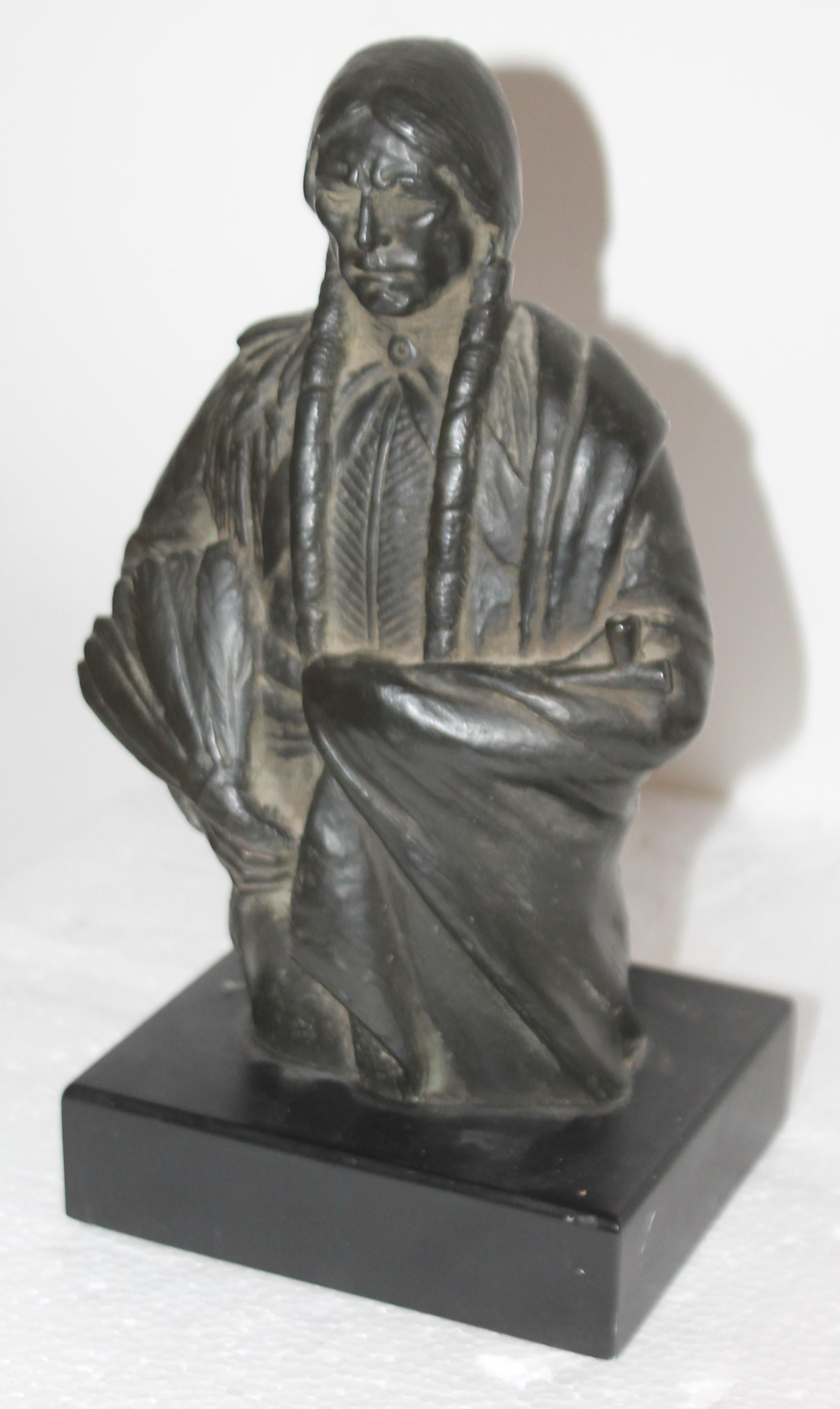 This amazing signed bronze patinated Resin Indian. Fantastic work. Signed 