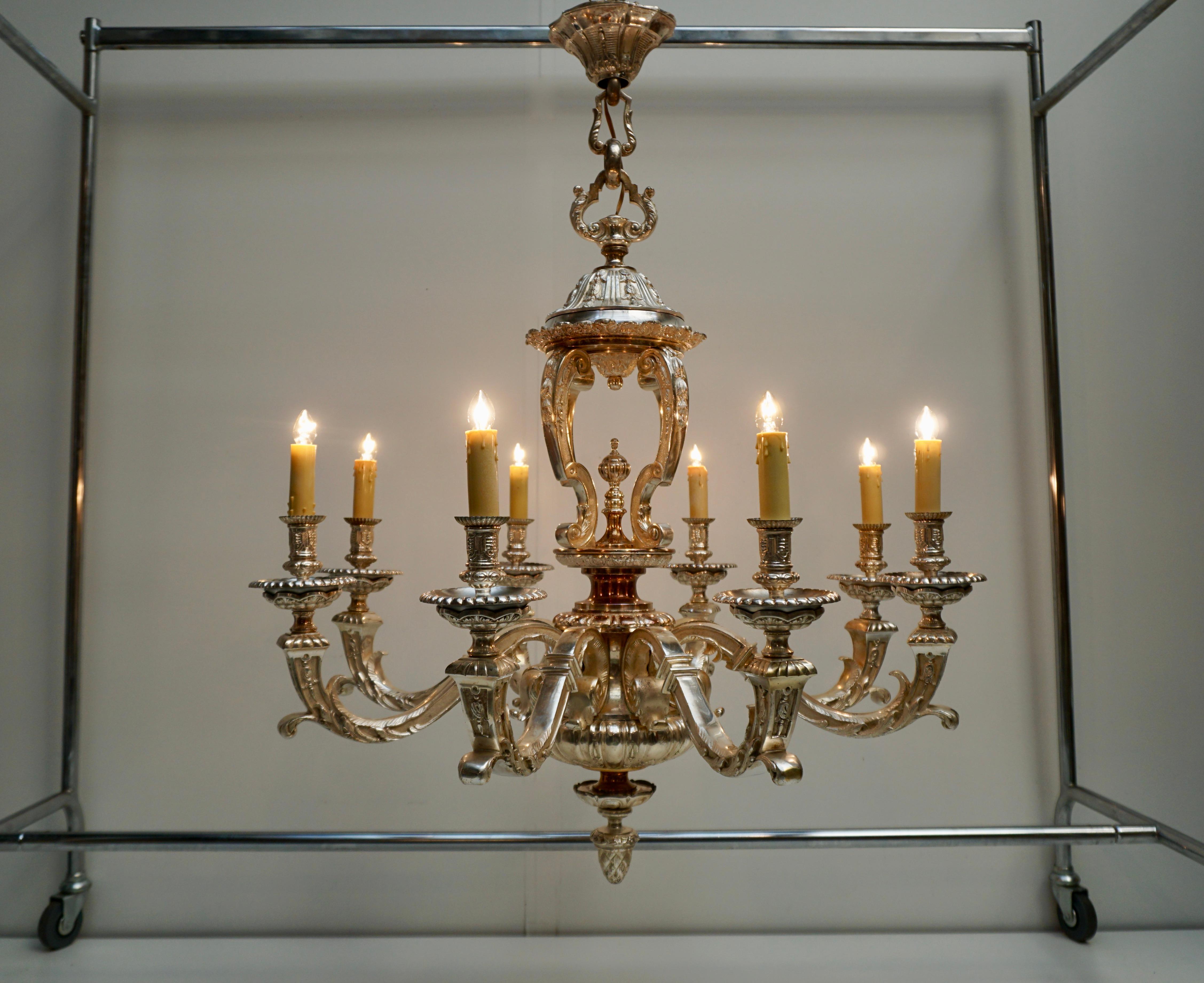 An outstanding and highly elegant bronze, silver plated chandelier, a so called “Lustre Mazarin”, of very good quality, with 8 arms and an interesting open worked baluster, decorated with scrolls and leaves. This chandelier dates from the early 19th