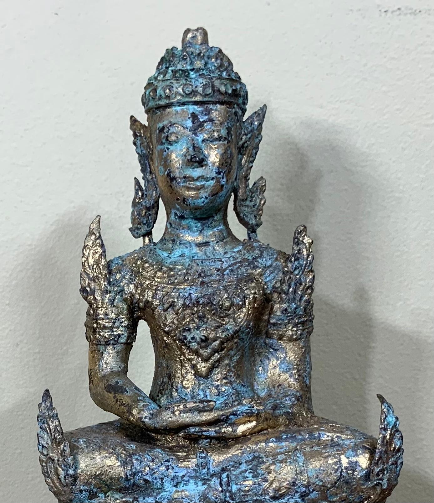 Elegant small sitting Buddha made of bronze circa 1960, gold leaf with Green - turquoise oxidisation color
Vivid details, great decorative item for any room.
