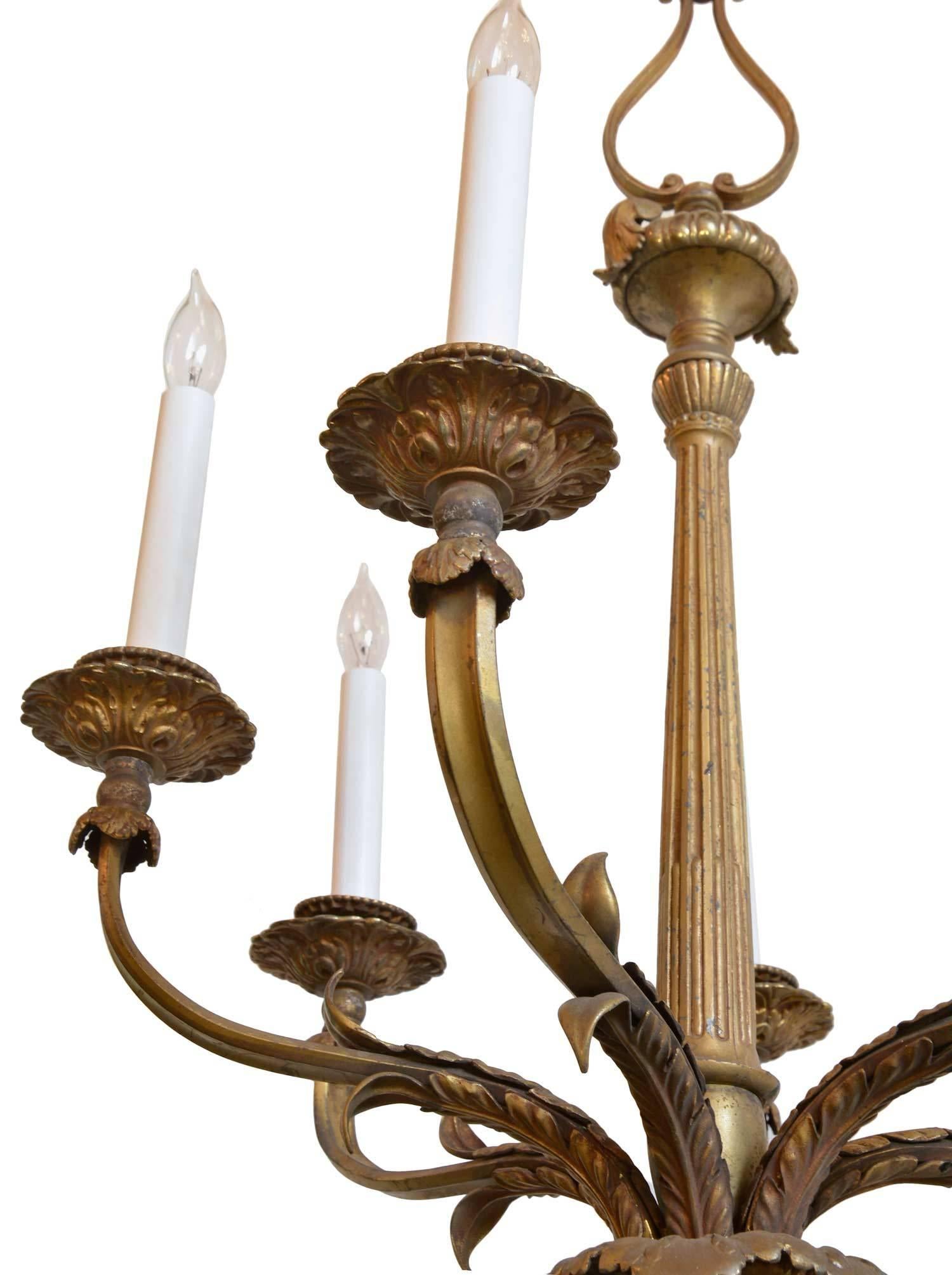 Six-light bronze chandelier with fluted centre pole and acanthus leaf detail. A timeless and elegant addition to any home.

Measure: 44