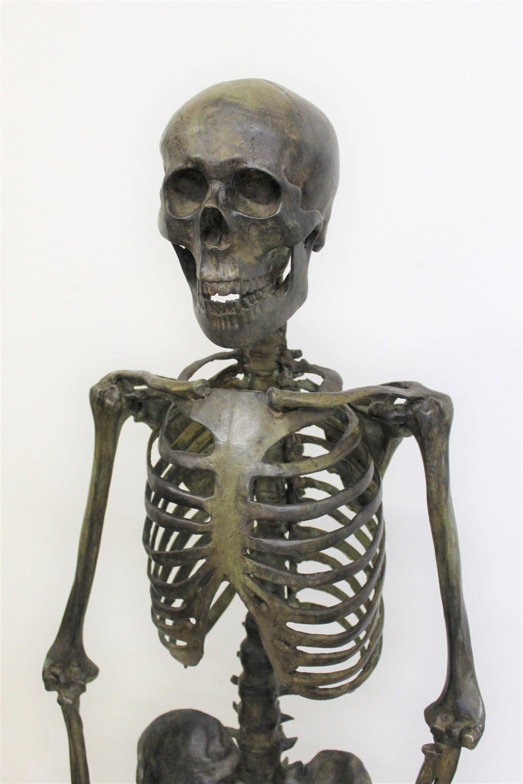 Patinated bronze skeleton, dark green patina, very well finished in details and details. exact copy of the human body.