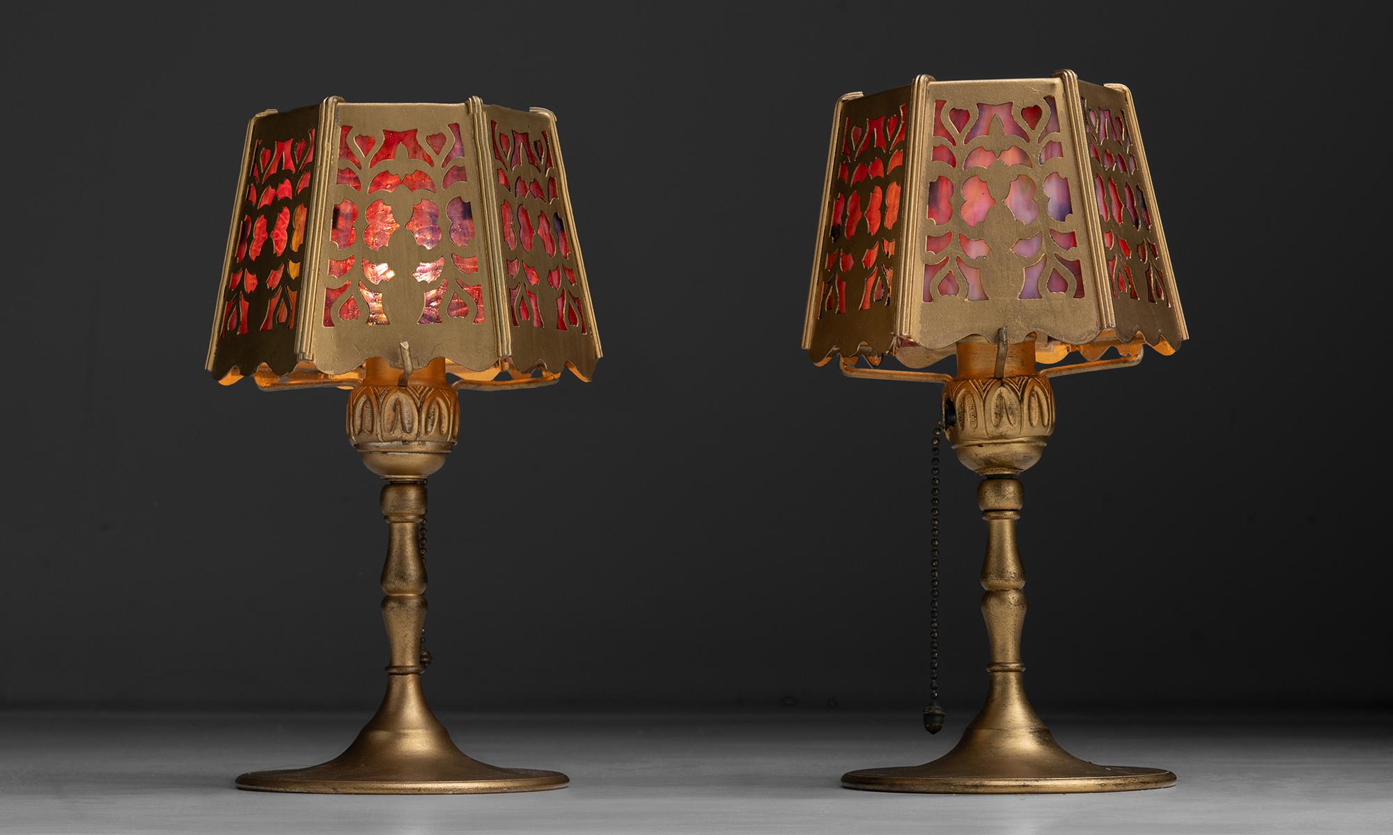 America, 1920
Small brass art deco boudoir table lamps with stained glass shades.
6