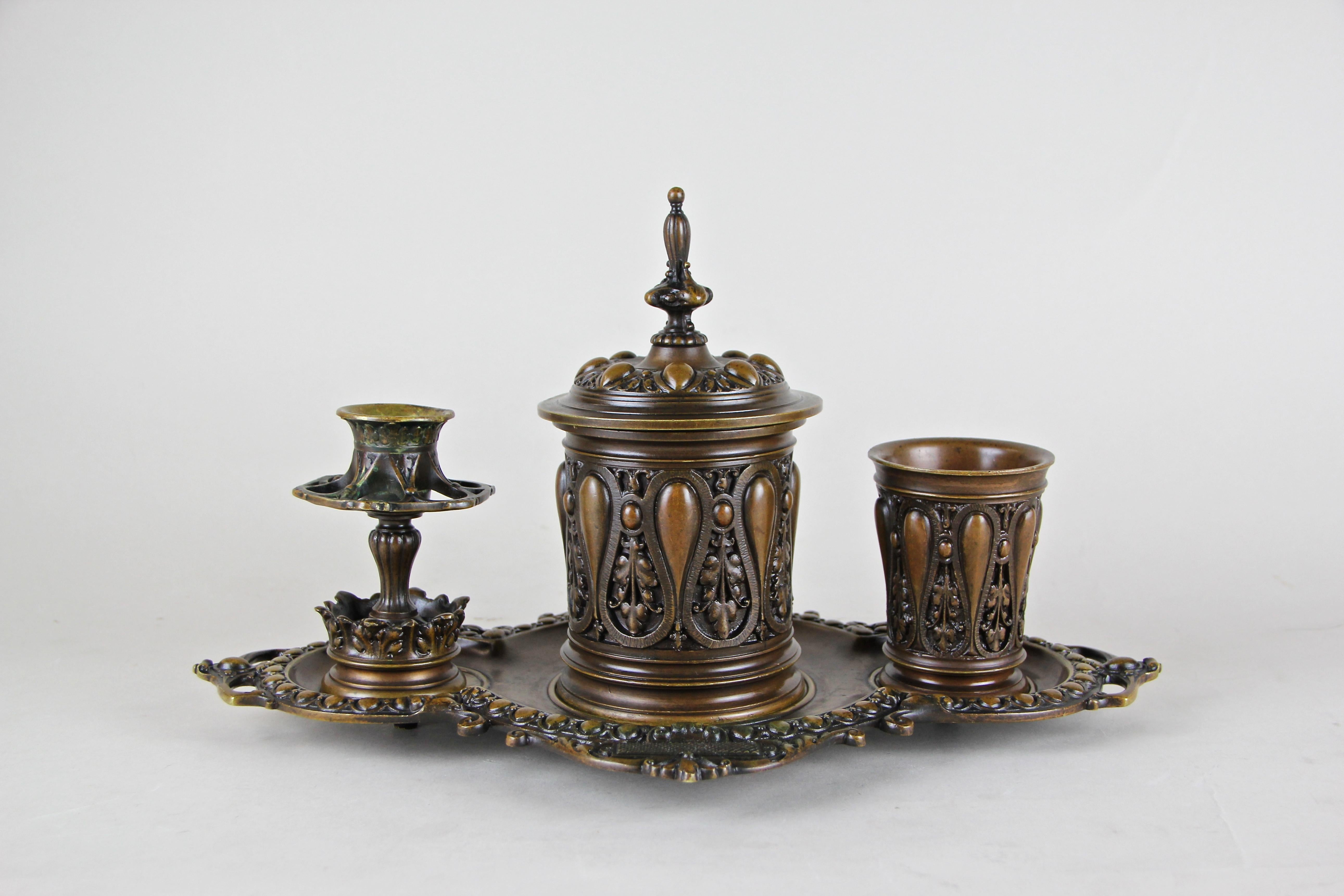 Fabulous bronze smoking set from the German Historism period circa 1880. This artful made heavy full-bronze set consist of four pieces: a nice shaped tableau on which stands a big tobacco box with a folding lid in the center (and removable brass