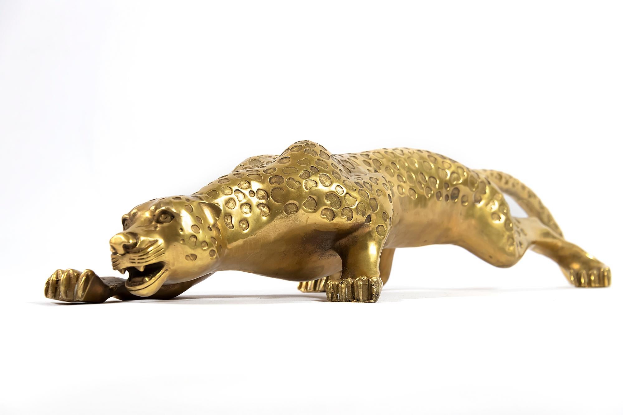 Bronze gepard sculpture in the shape of sneaking animal.
