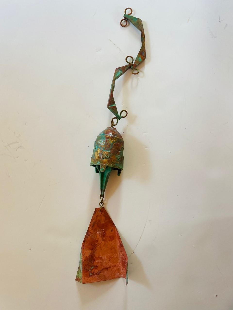 Beautiful bronze Cosanti bell by Paolo Soleri. Uncommon shape and design. Fantastic patina and a great sound. Signed. A unique piece from a celebrated artist. Unique attribute to this piece is a bluish green and rust color patina.

Paolo Soleri