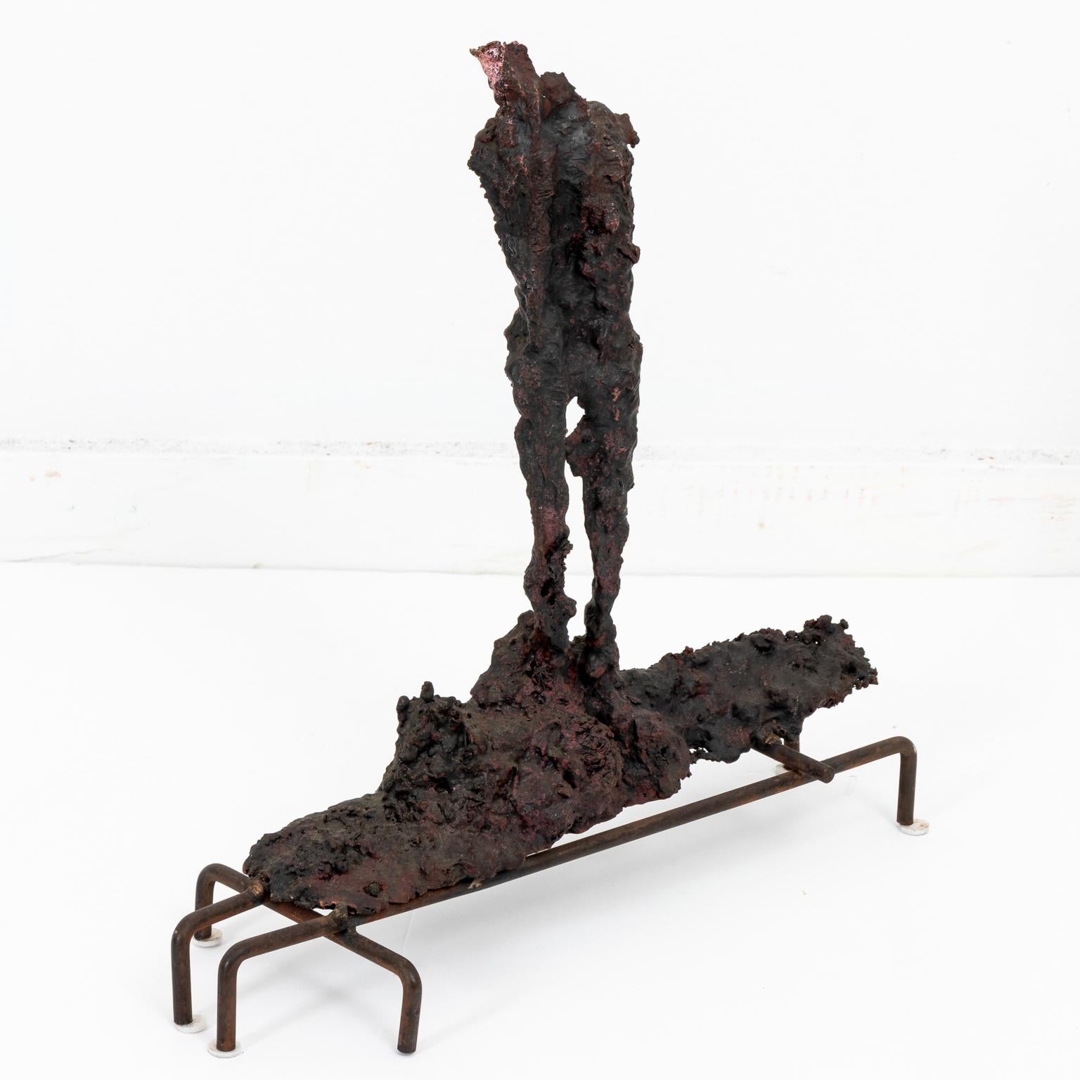 Abstract bronze spill cast sculpture in the Brutalist style mounted on a metal four prong base, circa 1960s. Made in the United States. Please note of wear consistent with age including oxidation and patina. The sculpture is also designed in the