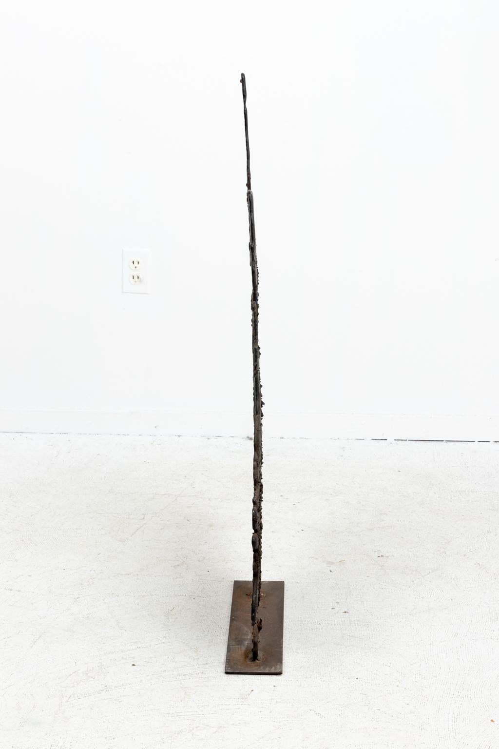 Monumental mid-century bronze spill cast sculpture in the style of Harry Bertoia. The spill cast technique, an exercise in randomness and chaos, was pioneered by Bertoia in the early 1960s. Molten bronze is poured onto a patch of sand making the