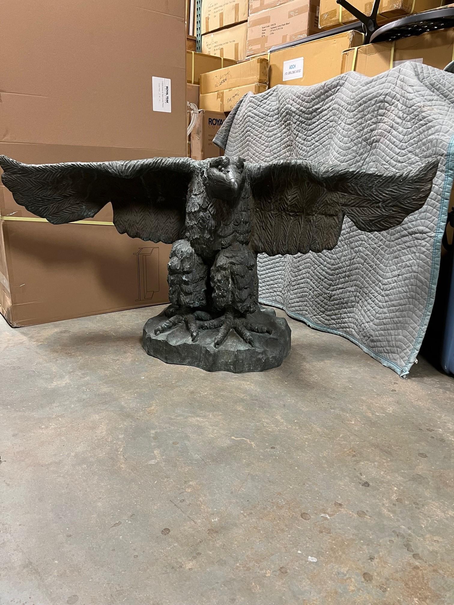 Monumental, spread winged eagle sculpture bronze console table signed by the artist. This is a wonderful bronze console that would look great in a foyer or outdoor on a patio or garden. It's a very heavy and solid piece and can hold a large marble