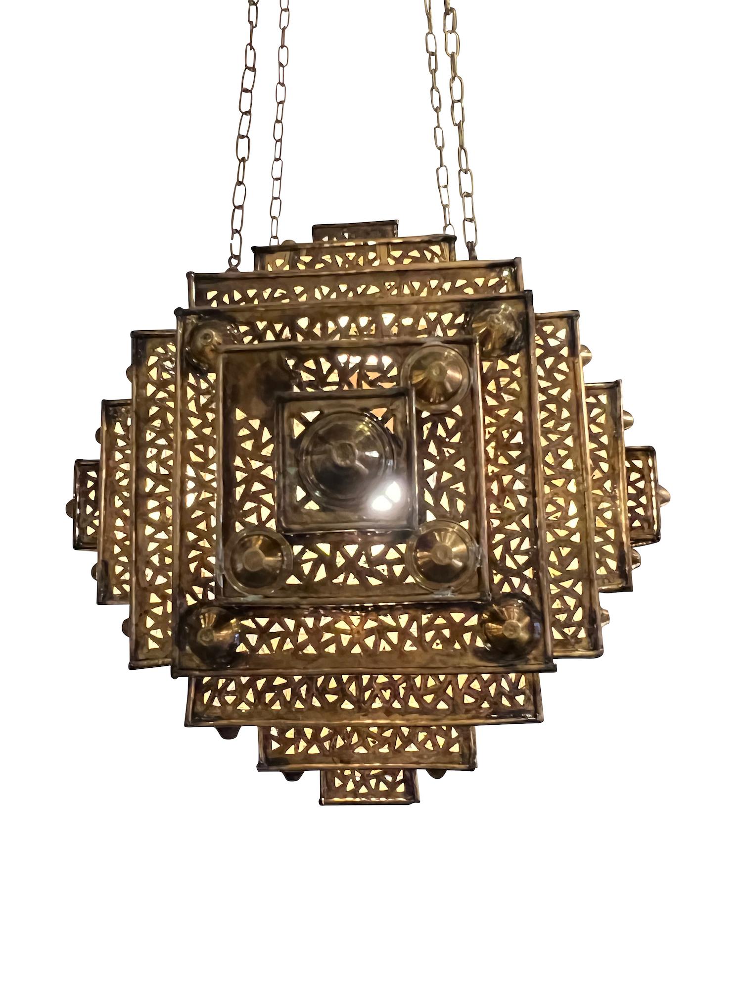 Moroccan square perforated bronze chandelier.
Multi-tiered design.
Recently rewired.
Overall height 57