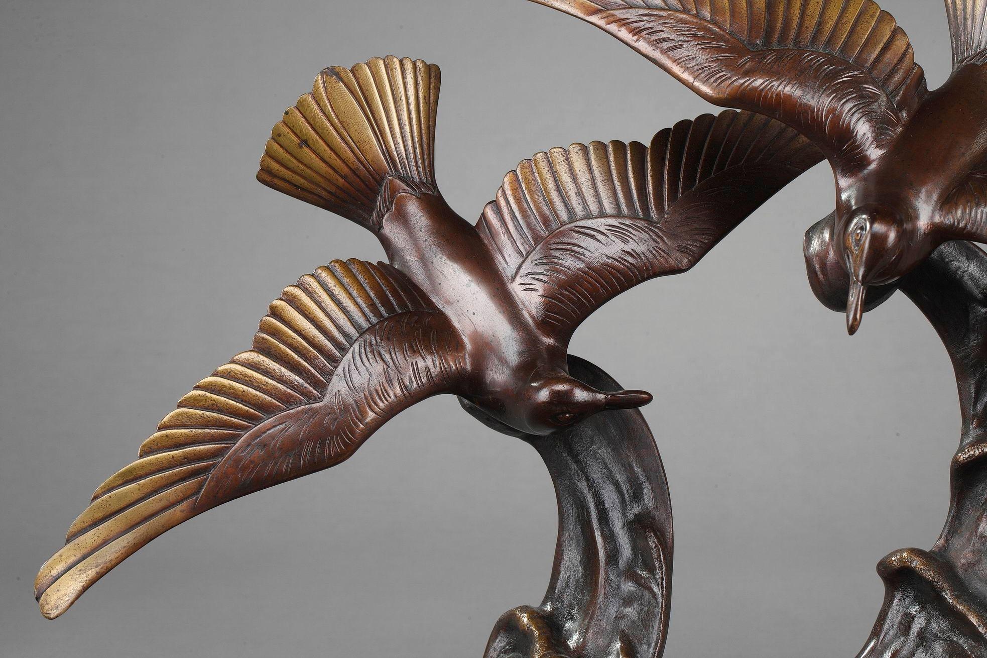 Art Deco-period bronze statue featuring two flying gulls skimming the crest of a wave. The sculpture is set upon a black marble base. Signed H. Molins for Enrique Molins Balleste (1893-1958), a Spanish sculptor born in Barcelona, working in Paris in