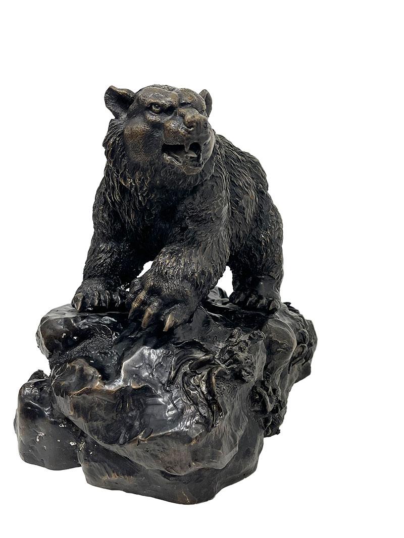Bronze statue of a bear, after Pierre-Jules Mêne (French, 1810 – 1879)

A bronze model of a bear on a rock. This large bronze bear of 34 cm high is signed 'P.J. Mene' and has a dark brown patina with highlights.
This bronze is after Pierre-Jules
