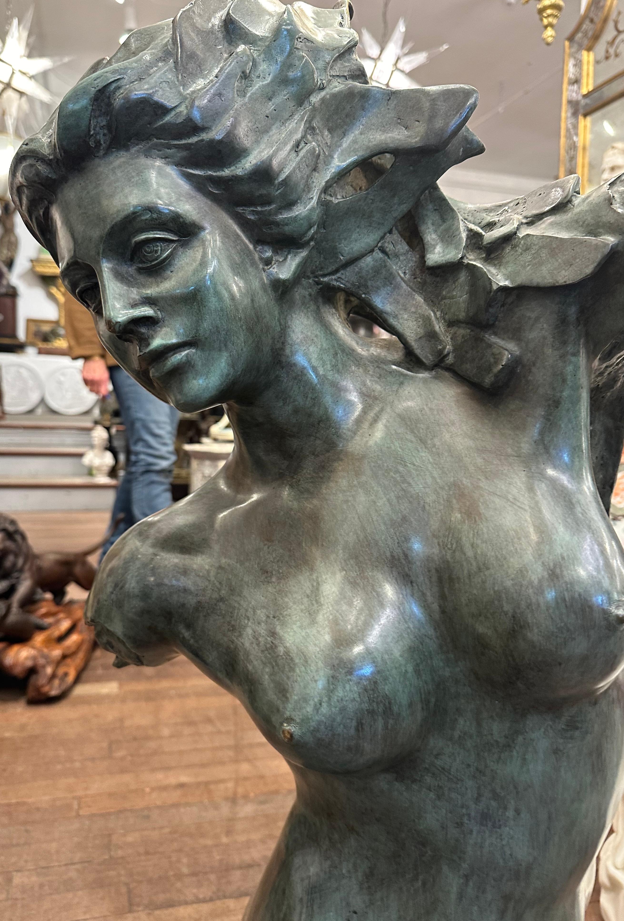 A highly decorative bronze casting of a female on a  solid black marble base. Beautifully detailed features and bronze colouration. This is a striking piece that would look delightful in any room.