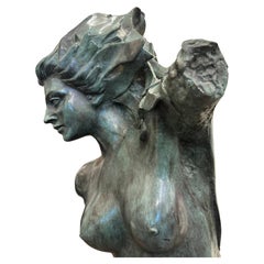 Bronze Statue Of A Female on Black Marble Base.