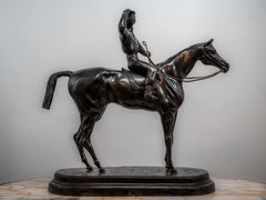 Bronze statue of a jockey on a horse sign Valton
