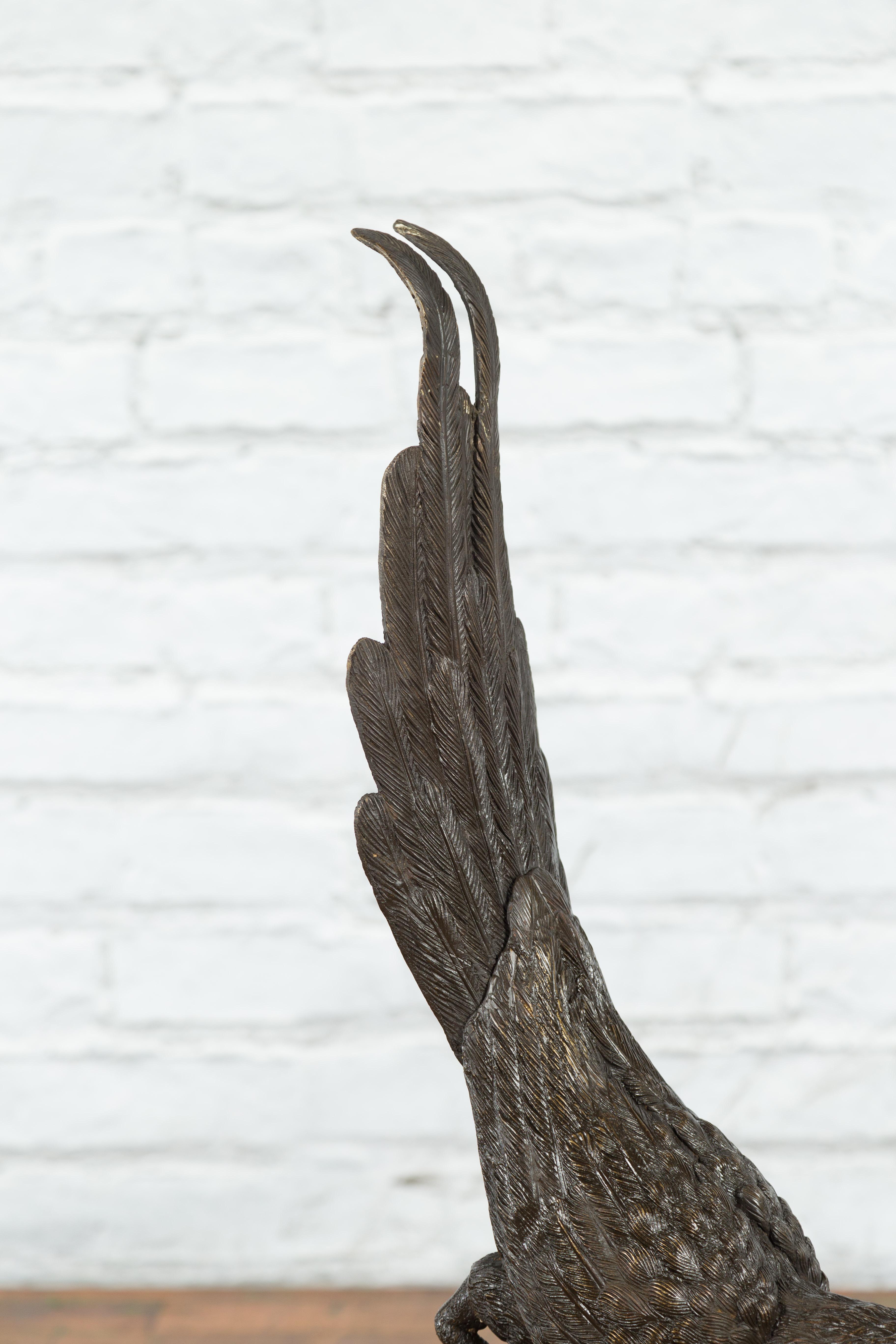 Bronze Statue of a Parrot Perched on a Branch and Leaning Down, with Dark Patina In Good Condition For Sale In Yonkers, NY