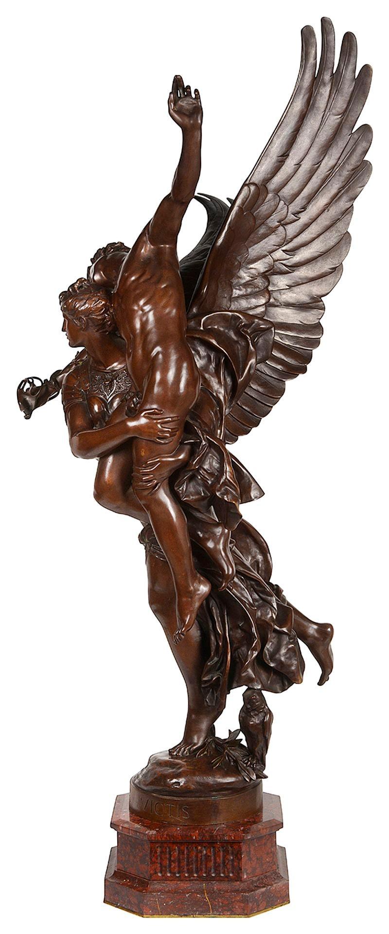 A fine quality bronze sculpture of Gloria Carrying the Angel Victis, Cast by Barbedienne and After a Model by Marius-Jean-Antonin Mercie´ (French, 1845-1916). The draped figure of Gloria carrying the angel Victis, mounted on a rouge marble
