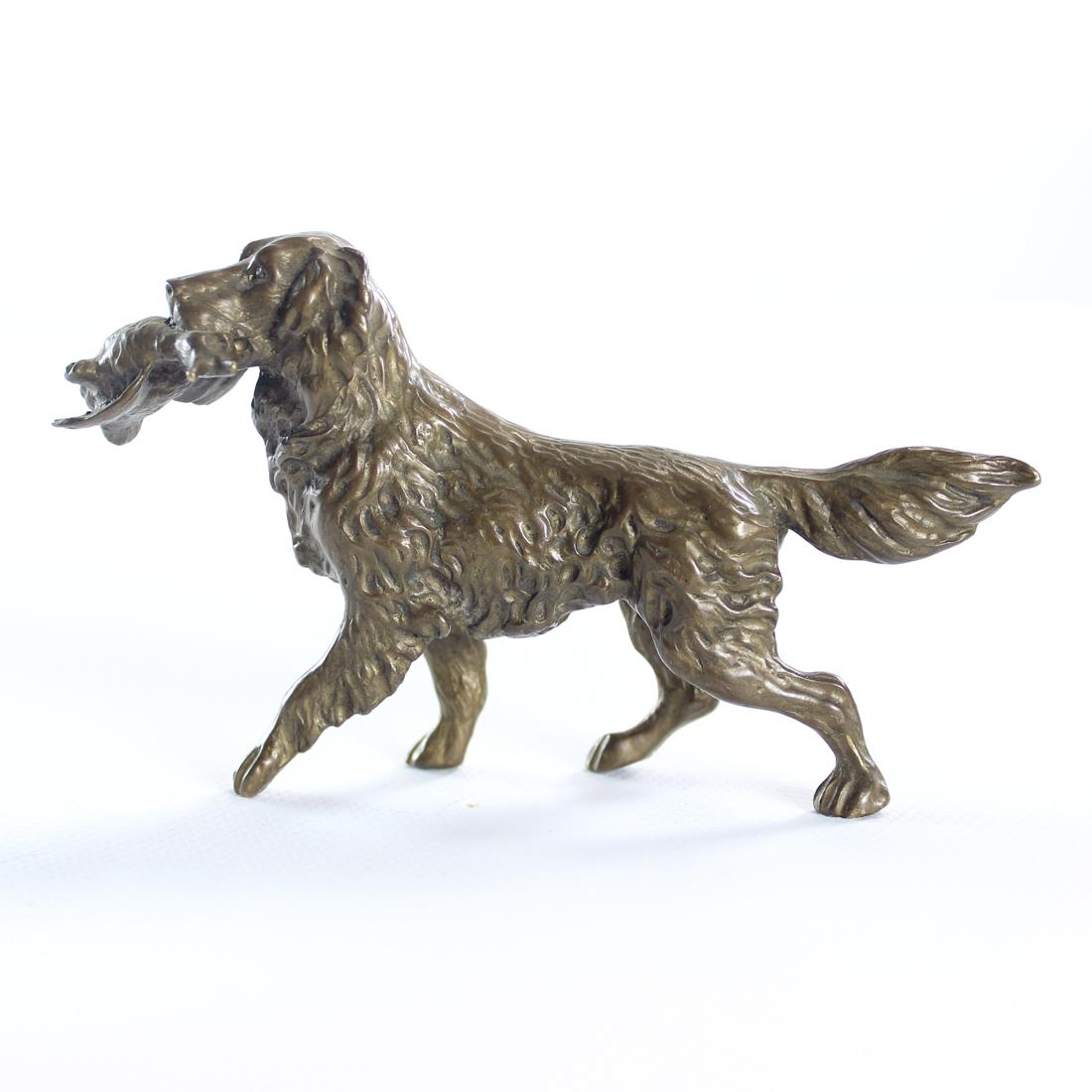 Beautiful bronze sculpture of a hunting dog, a retriever with duck. The sculpture was produced in Czechoslovakia in art deco era. Beautiful detailed art work shows the dog perfectly with every hair and expression in place. Beautiful dog structure in