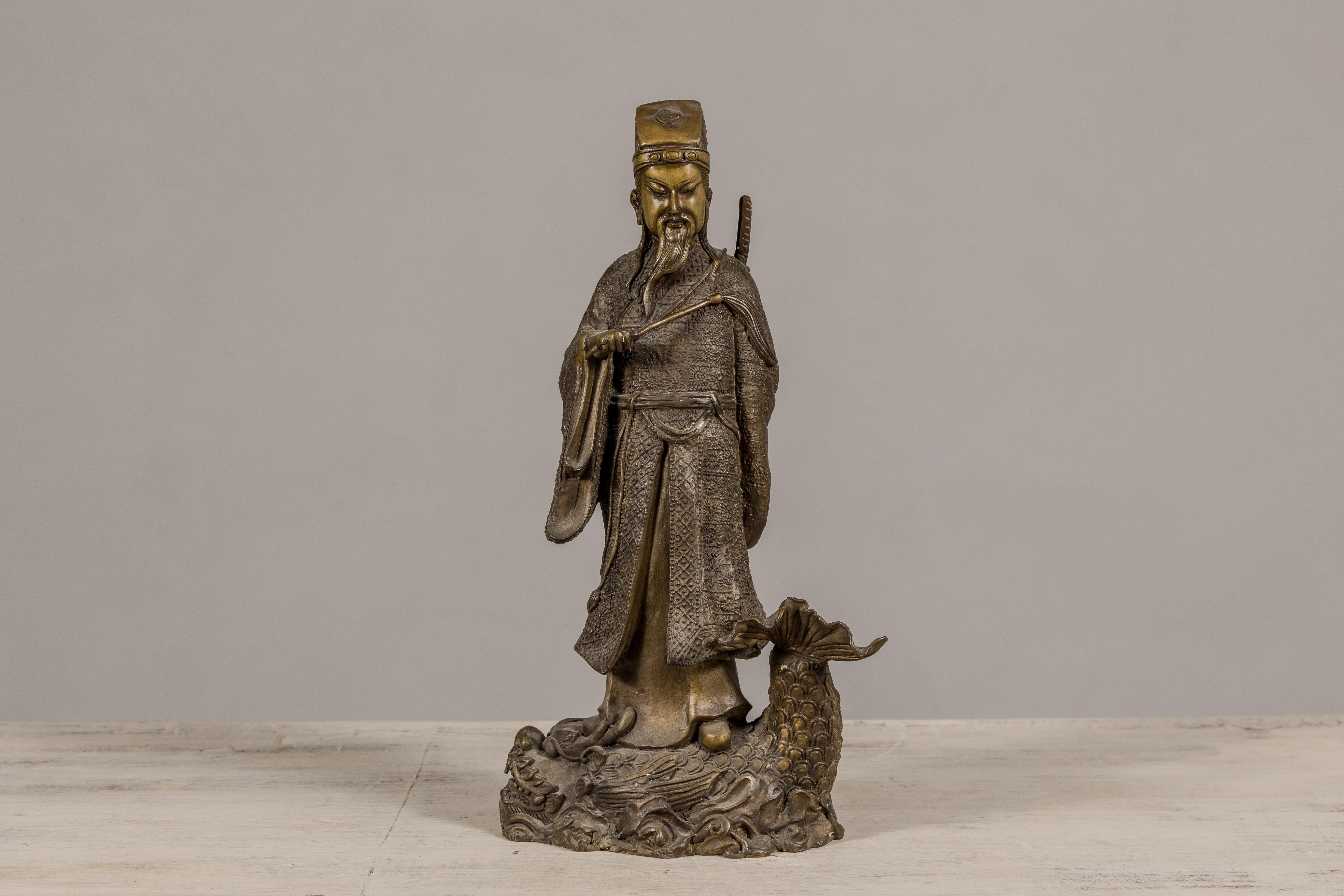 20th Century Bronze Statuette of a Chinese Ancestral Figure Standing on a Giant Fish For Sale