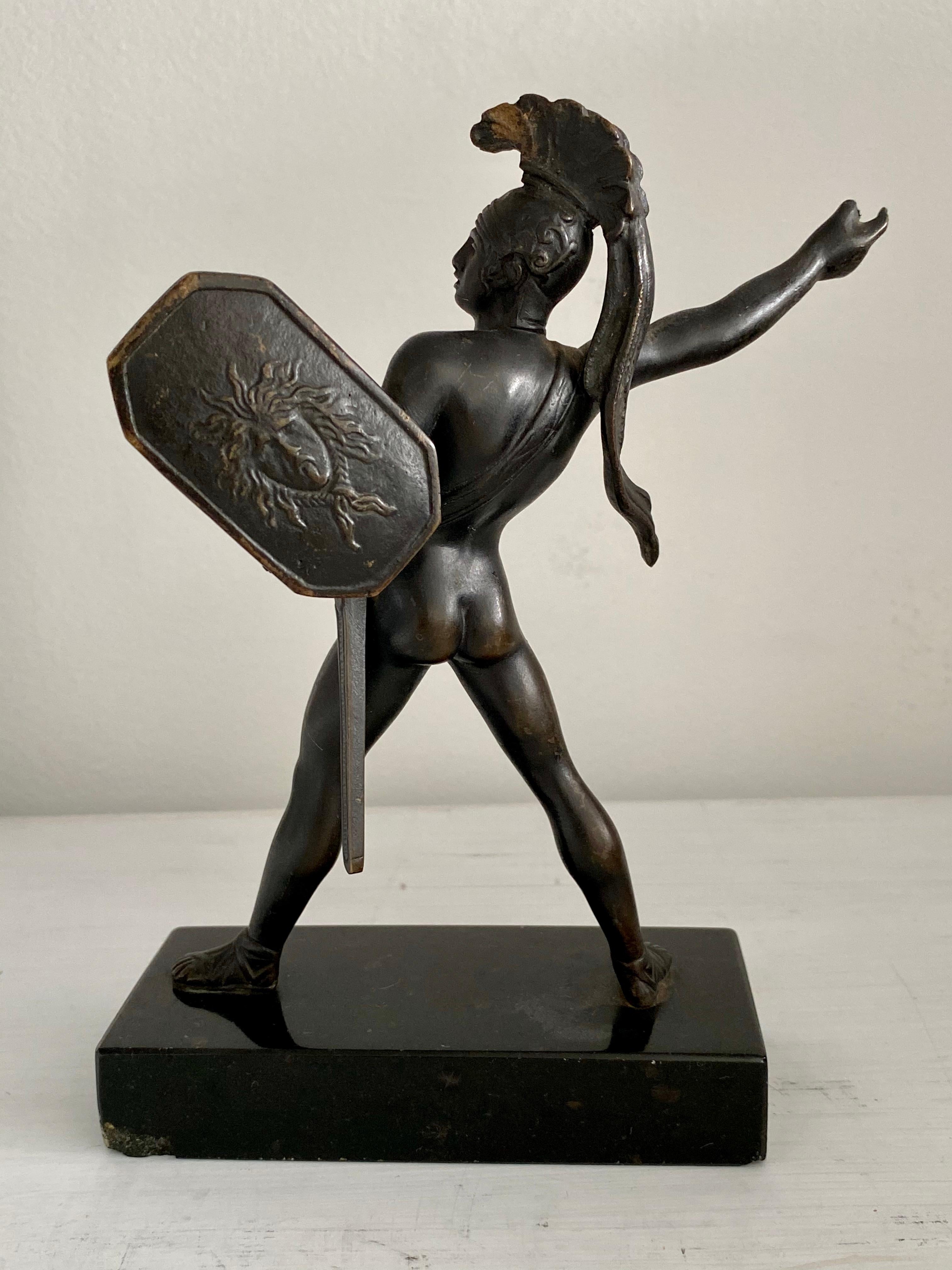 This well modeled and cast neoclassical French bronze from the 19th century recalls a moment in battle of the hero Achilles, a master of hand to hand combat. In this confident pose ready to throw a spear (now missing). Special note is made of the