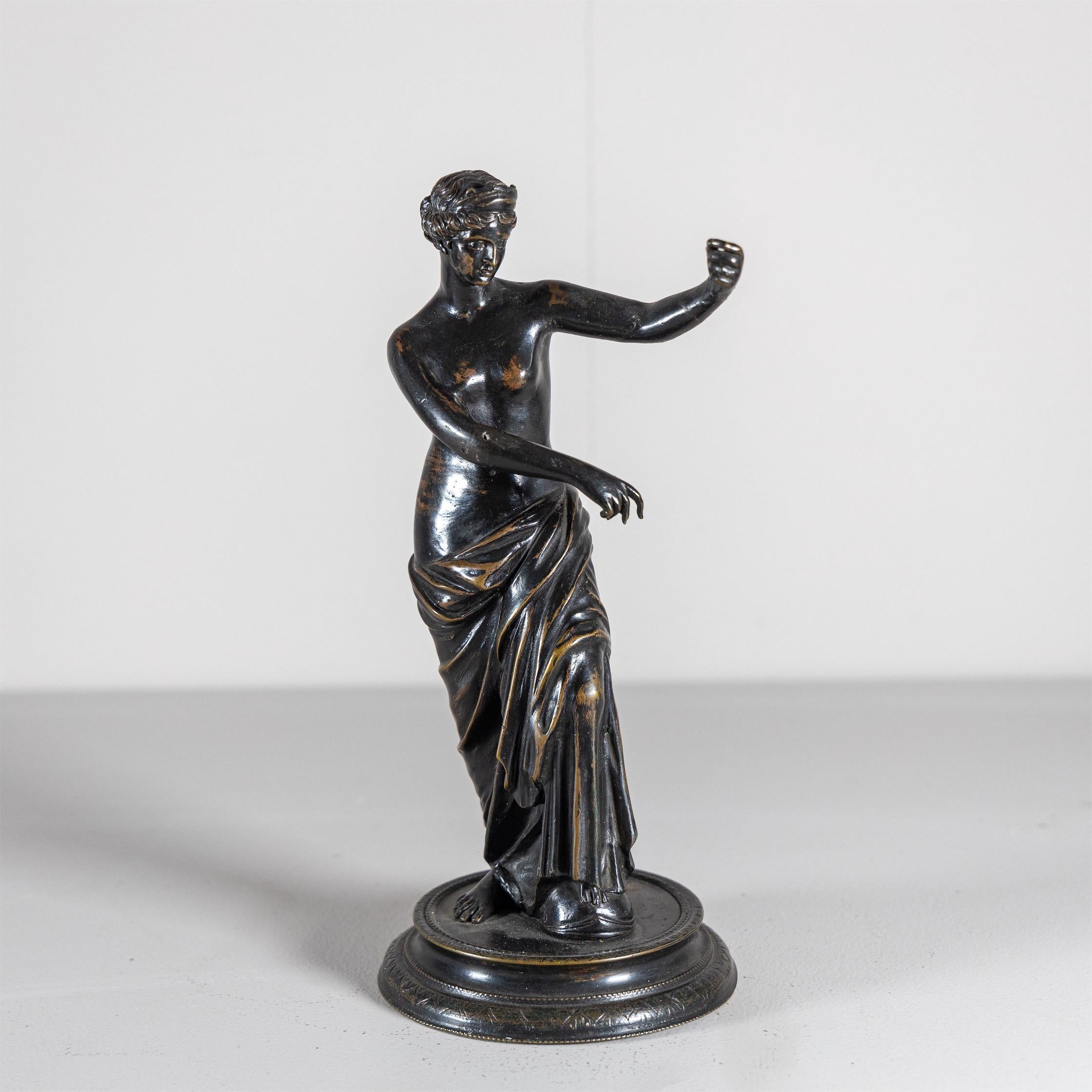 Small dark patinated figure of Venus on round profiled plinth.