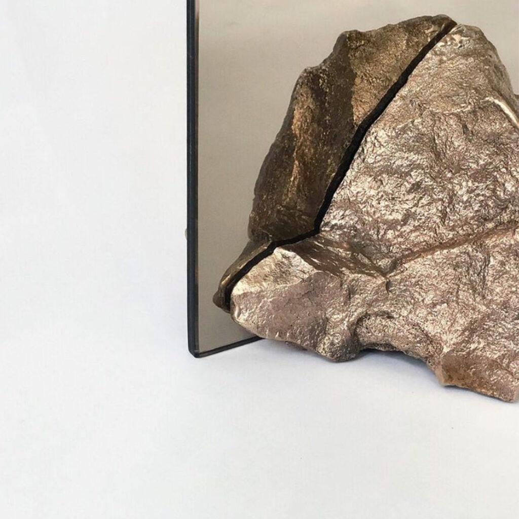 Stone Mirror explores our connection with nature and how our perception of mundane objects (such as found stones) changes if they are made from a material that is considered more valuable.
I perceive stones as jewels found in nature, as something