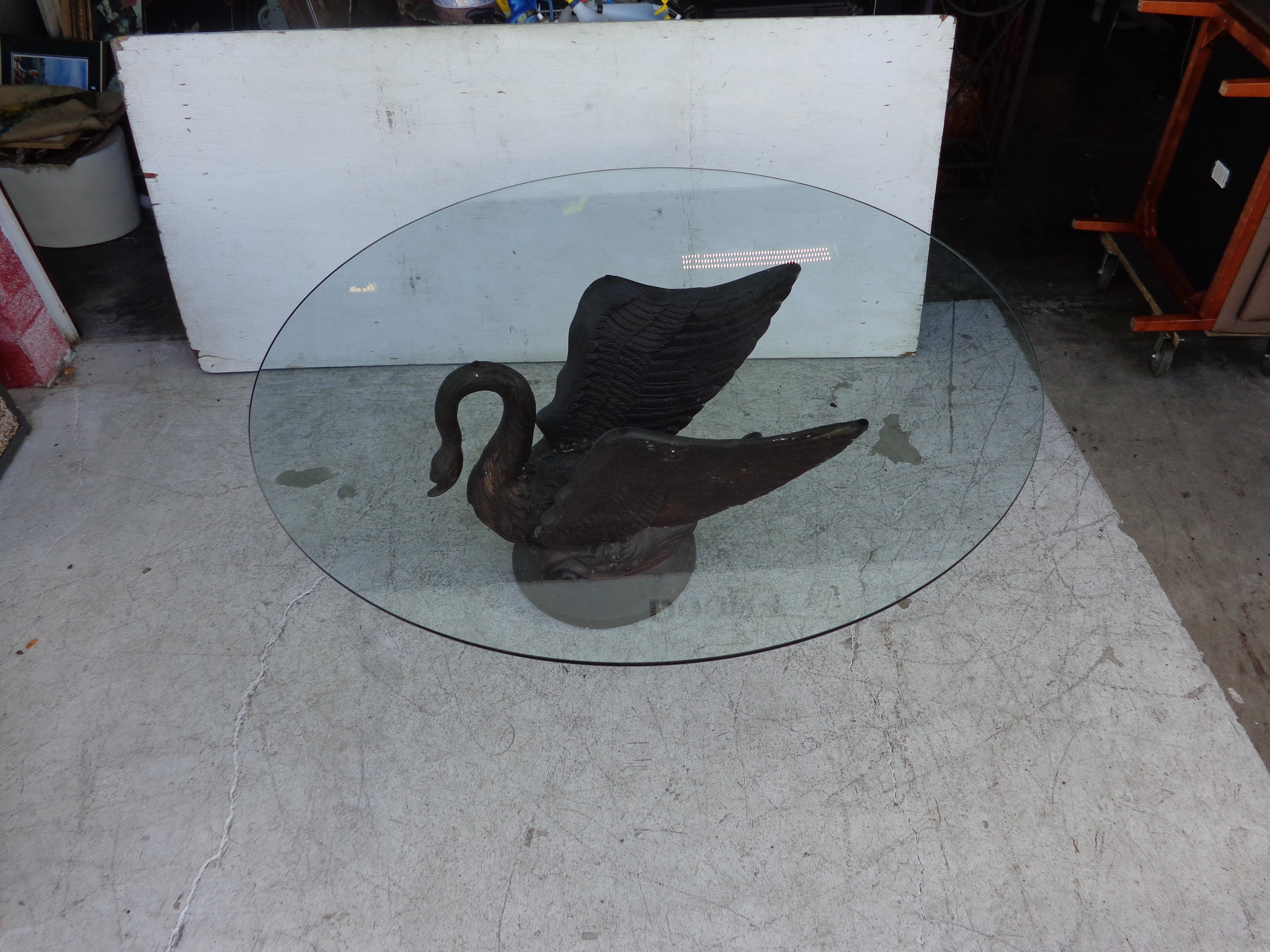 A richly patinaed bronze dining table base in the form of a swan. Top is 63