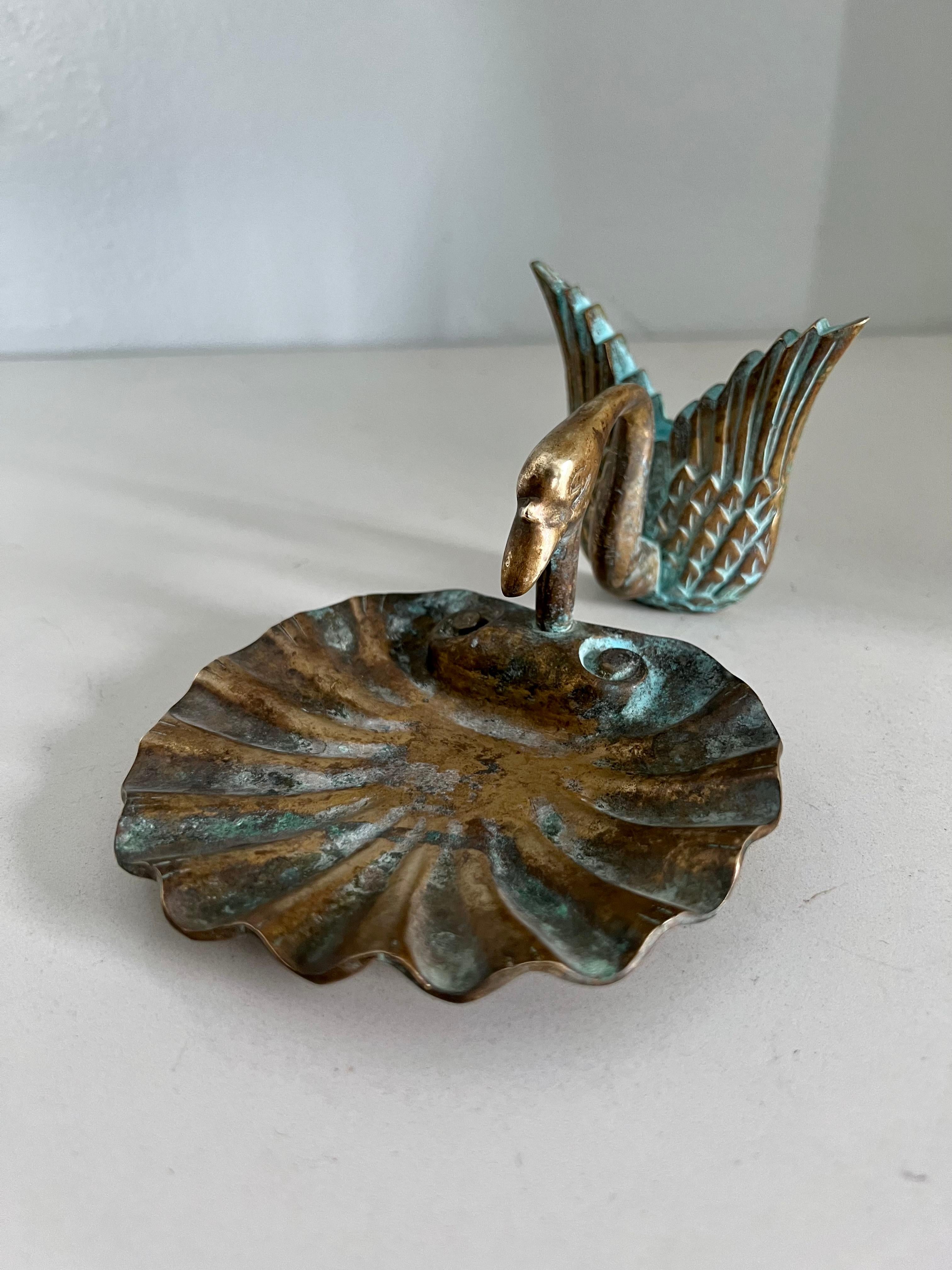 A wonderful brass or bronze soap dish of a swan or goose with a shell shaped holder. The piece represents the mid century or earlier and is a compliment to bathrooms or work areas for a bar of soap, or even on a desk to hold supplies. 

The piece