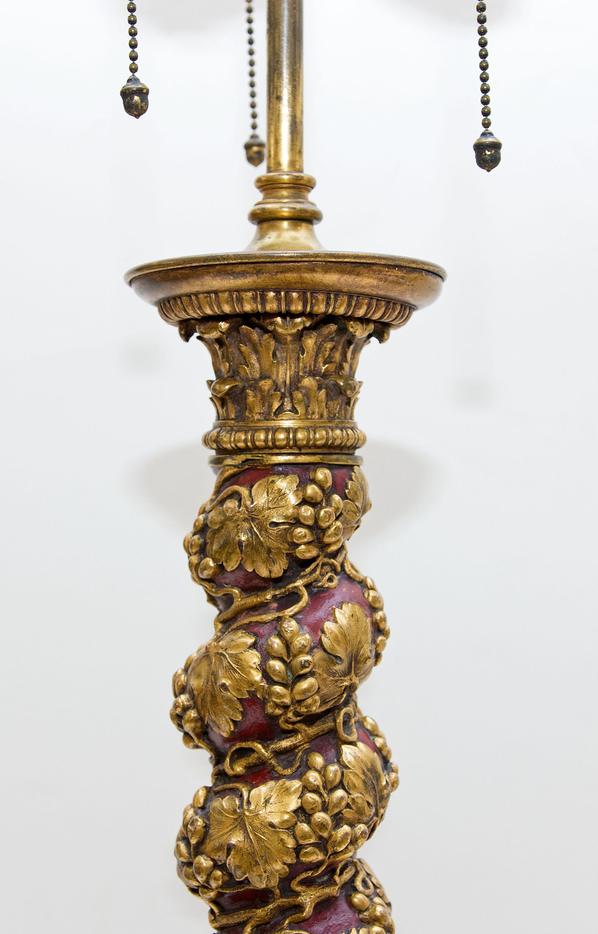 Antique Italian Renaissance style bronze table lamp. Made by E.F. Caldwell. Polished and cold painted bronze. Decorated with grape vines, circa 1910.