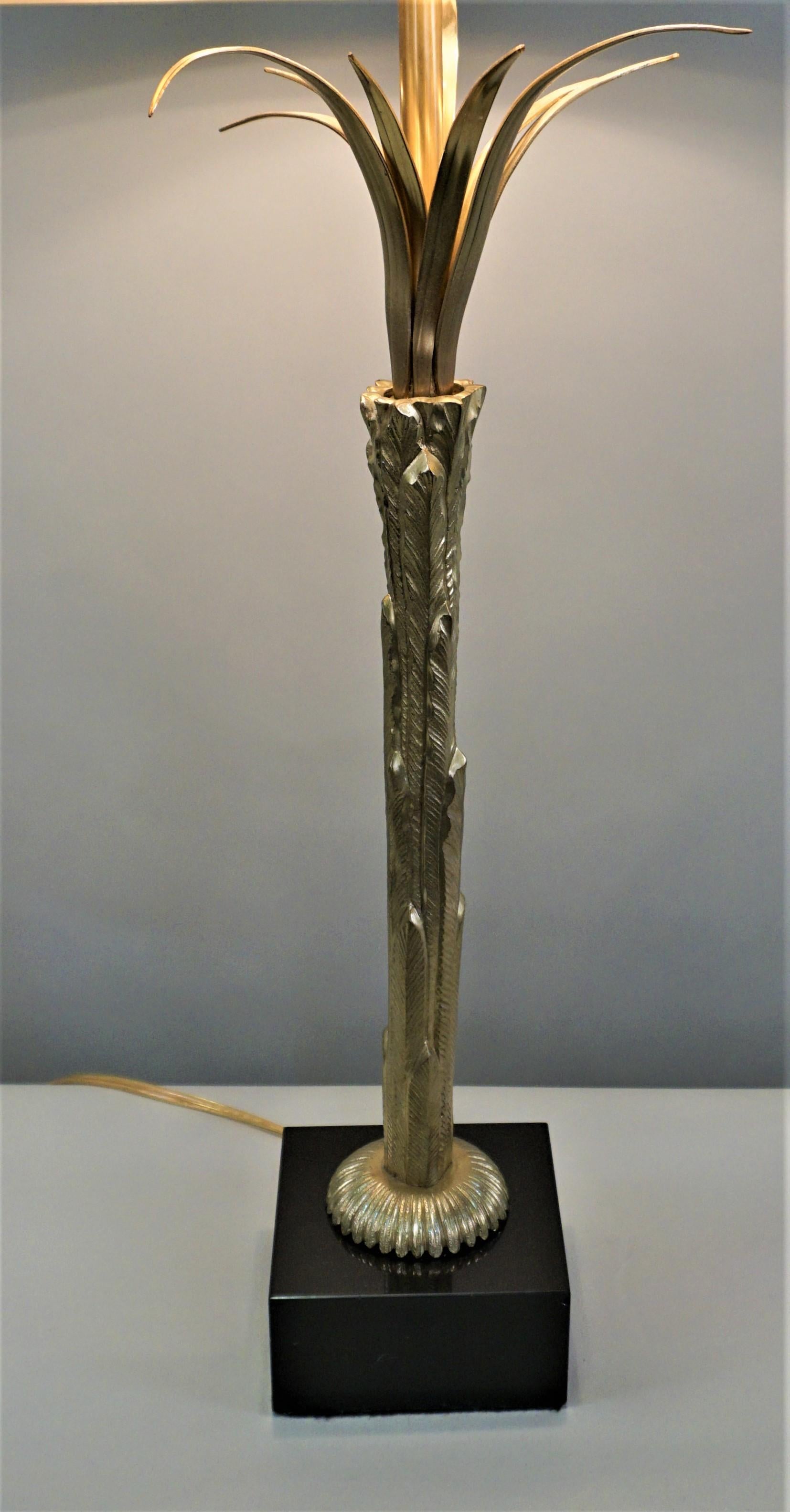 A rare bronze table lamp with original shade by Maison Charles.
Modified with 3 medium base socket with new wiring.