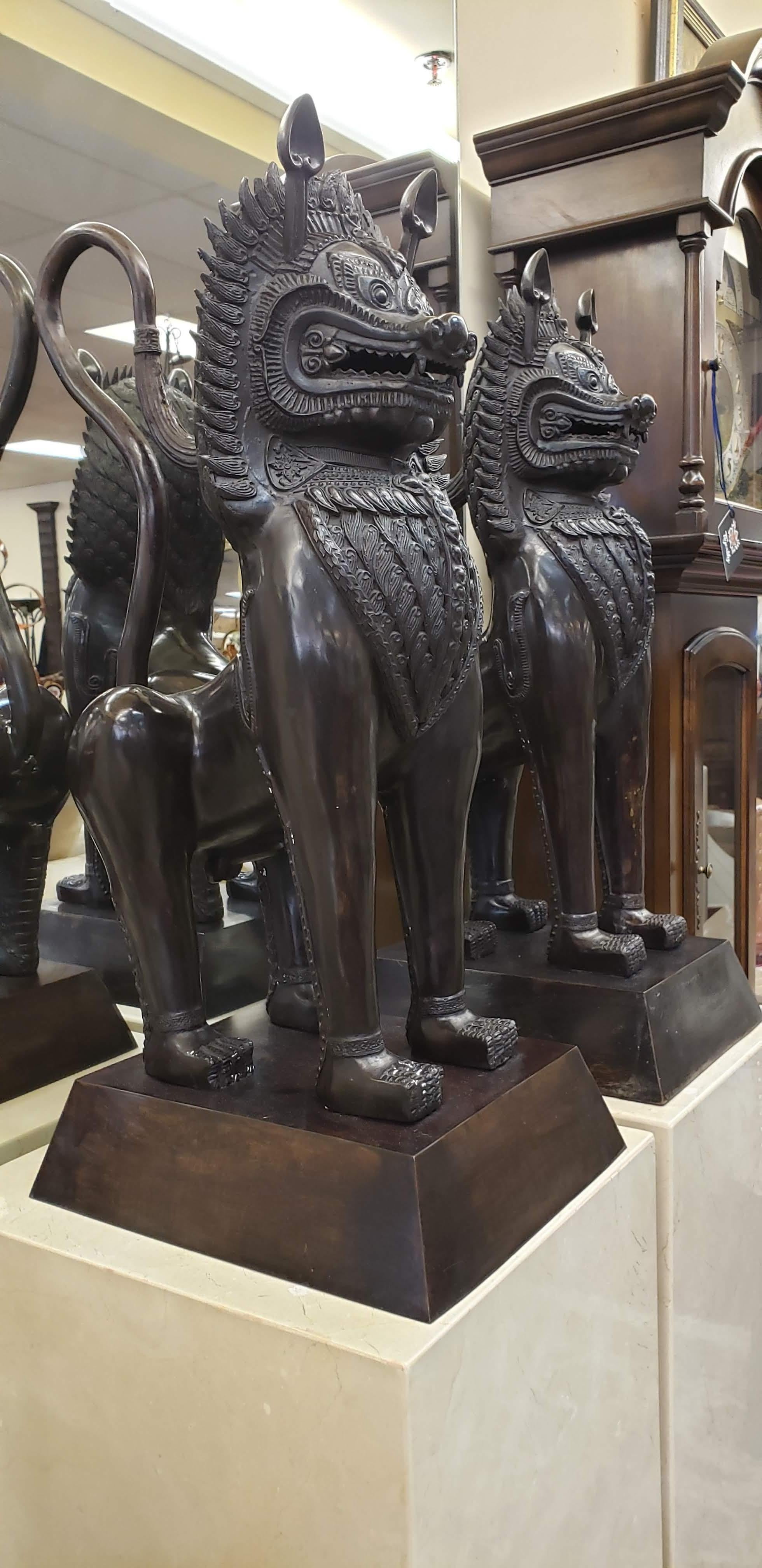 Bronze Temple Lion Foo Dogs on Marble Pedestals, Pair In Good Condition In Palm Beach Gardens, FL