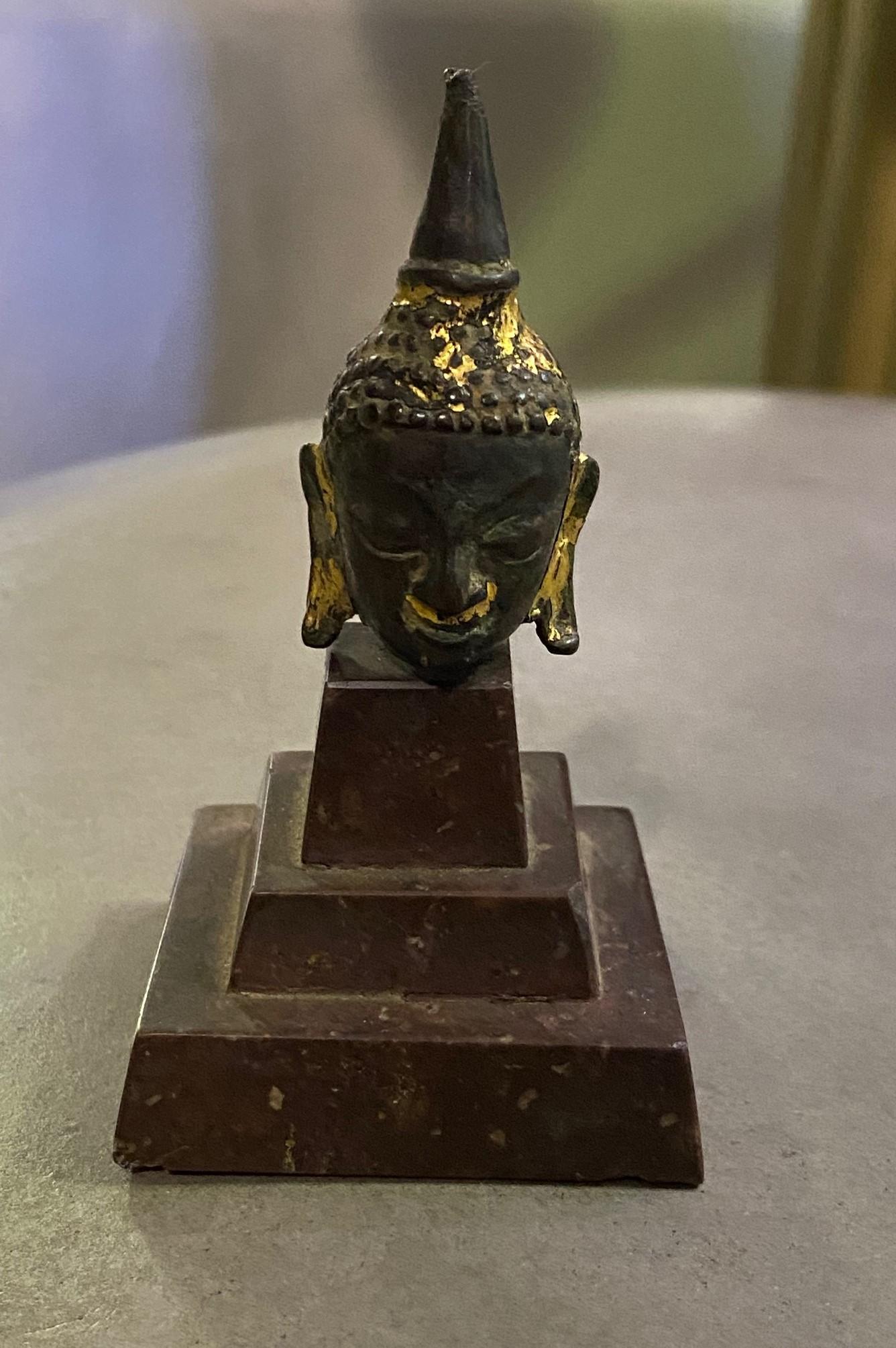 A wonderful, little gem of a piece. Thai/ Siam meditating Buddha with serenely closed eyes in the Kamphaeng Phet style. The piece has a beautiful patina acquired over time. 

From a collection of Asian antiques. Would be a nice addition to any