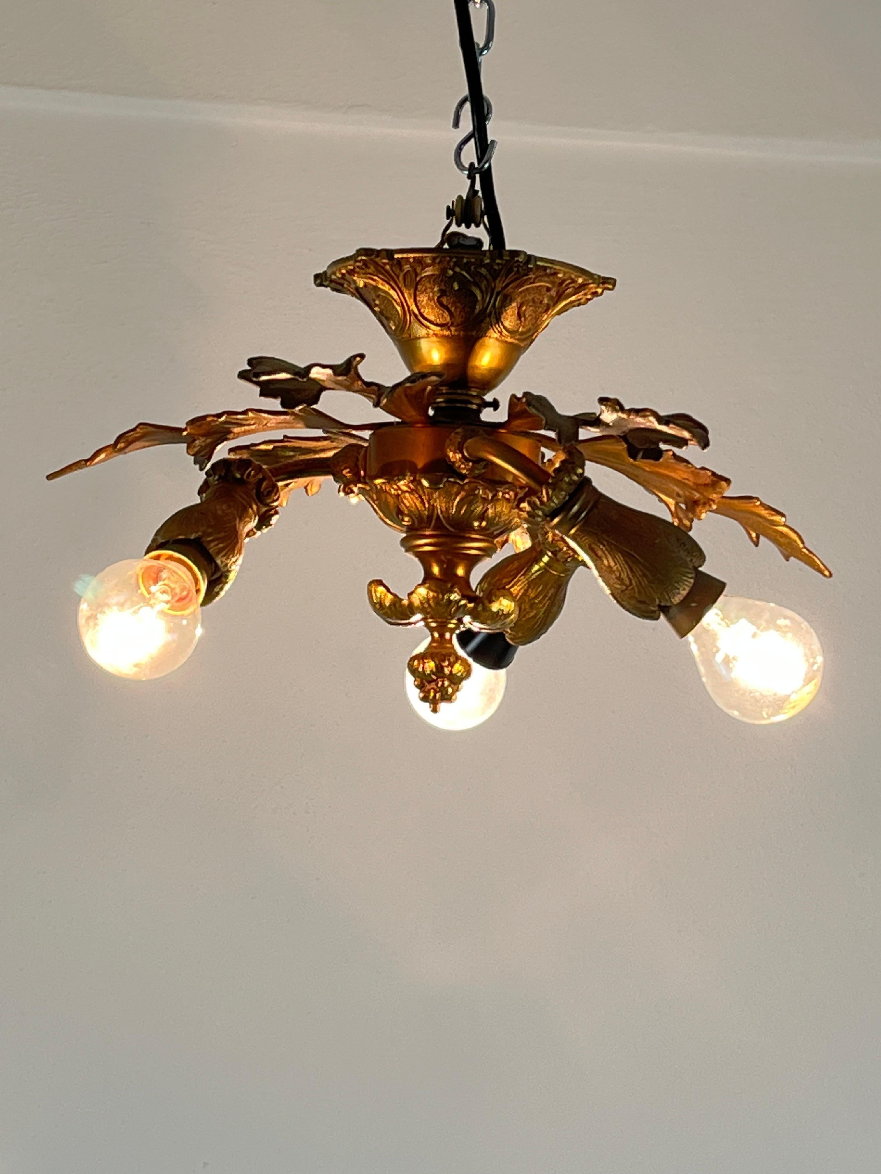 Bronze three-light chandelier, Italy, 1960s.
It has always belonged to my family, purchased by my great-grandparents. In good condition, intact and functional.