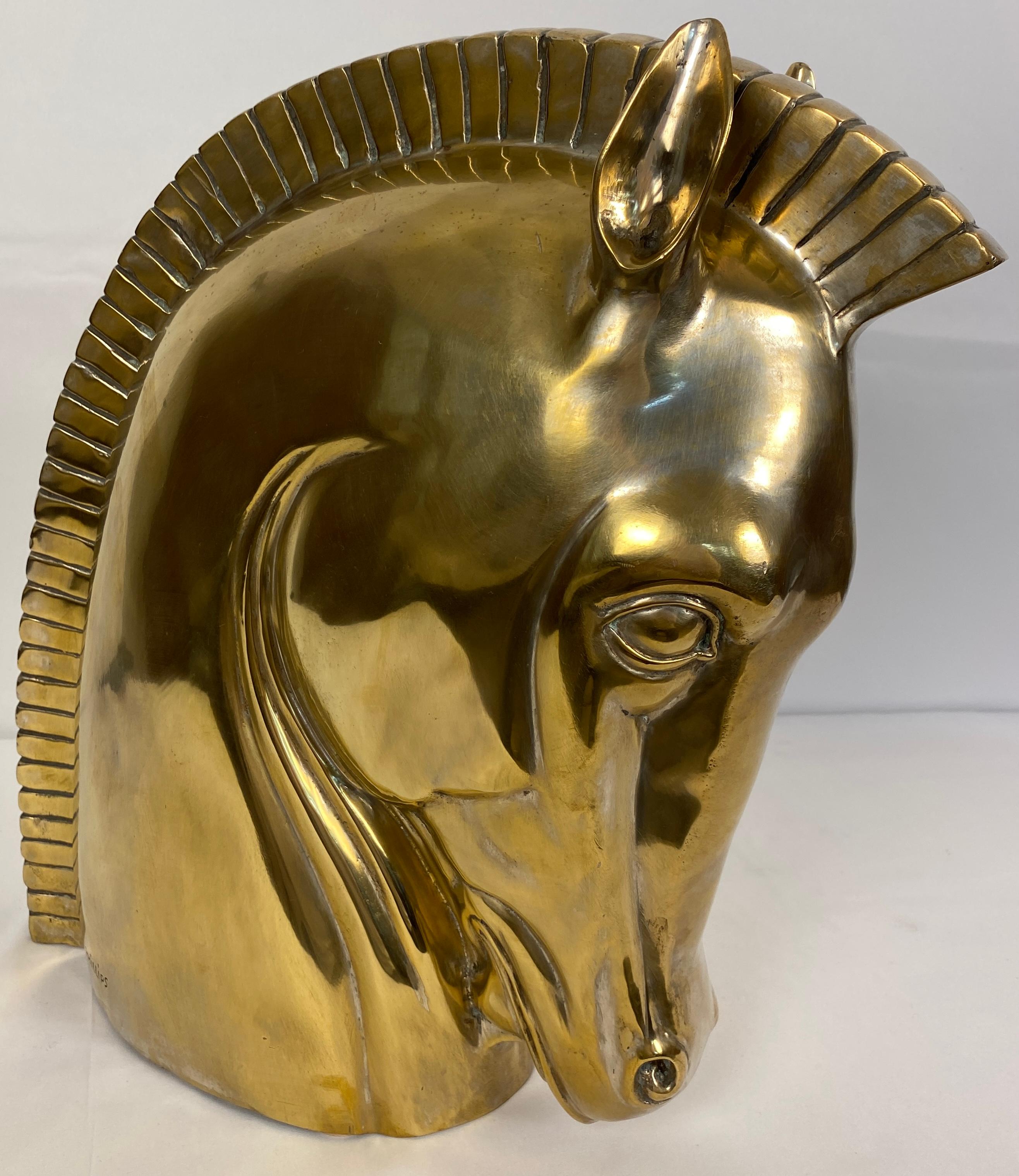 A stunning modern design of a bronze trojan horse head.
Made of cast bronze with a beautiful patina consistent with age.
Signed Phillips. 

This bronze trojan horse head sculpture will enhance any modern or contemporary setting. Delightfully heavy,