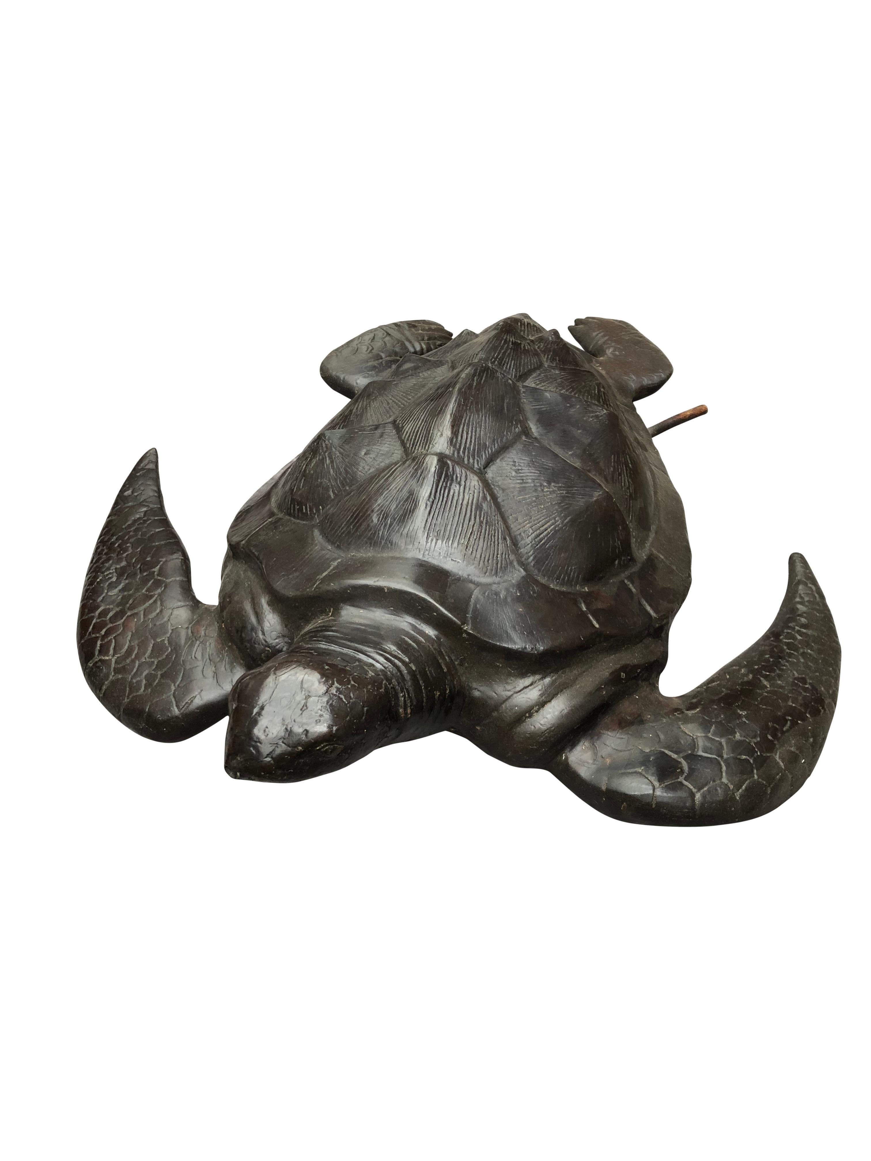 A gorgeous bronze casting of a sea turtle. Fantastic dark brown patina to this piece. Functions as a fountain with the water spouting from the mouth. Of course being bronze this piece can live outside with no fear of rusting. Offered in excellent