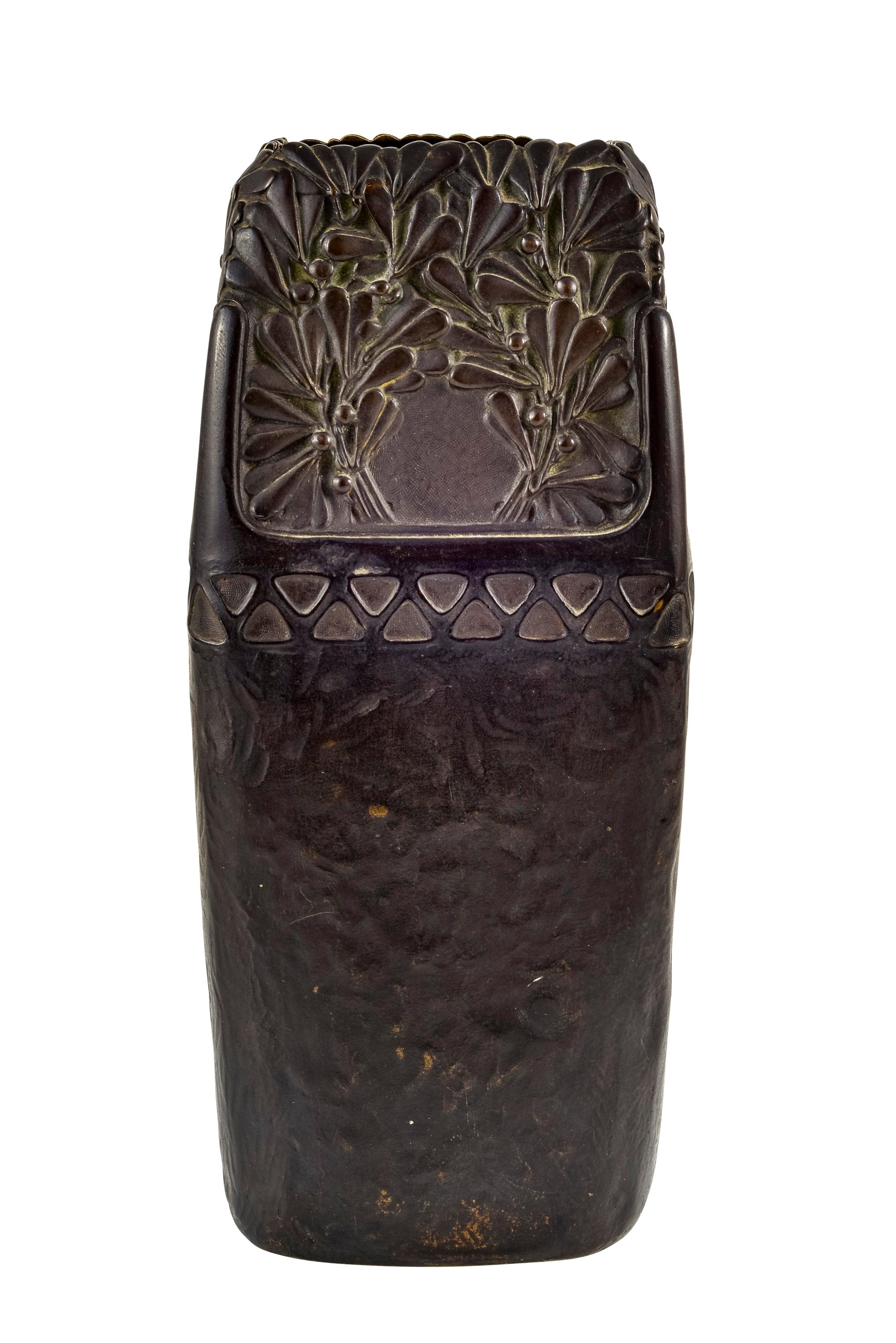 Bronze Vase circa 1903 Floral Relief Austrian Jugendstil designed by Gustav Gurschner manufactured by K. K. Kunst-Erzgiesserei Wien

This vase with its rectangular shape, slightly tapering towards the top, impresses with its massive size and its