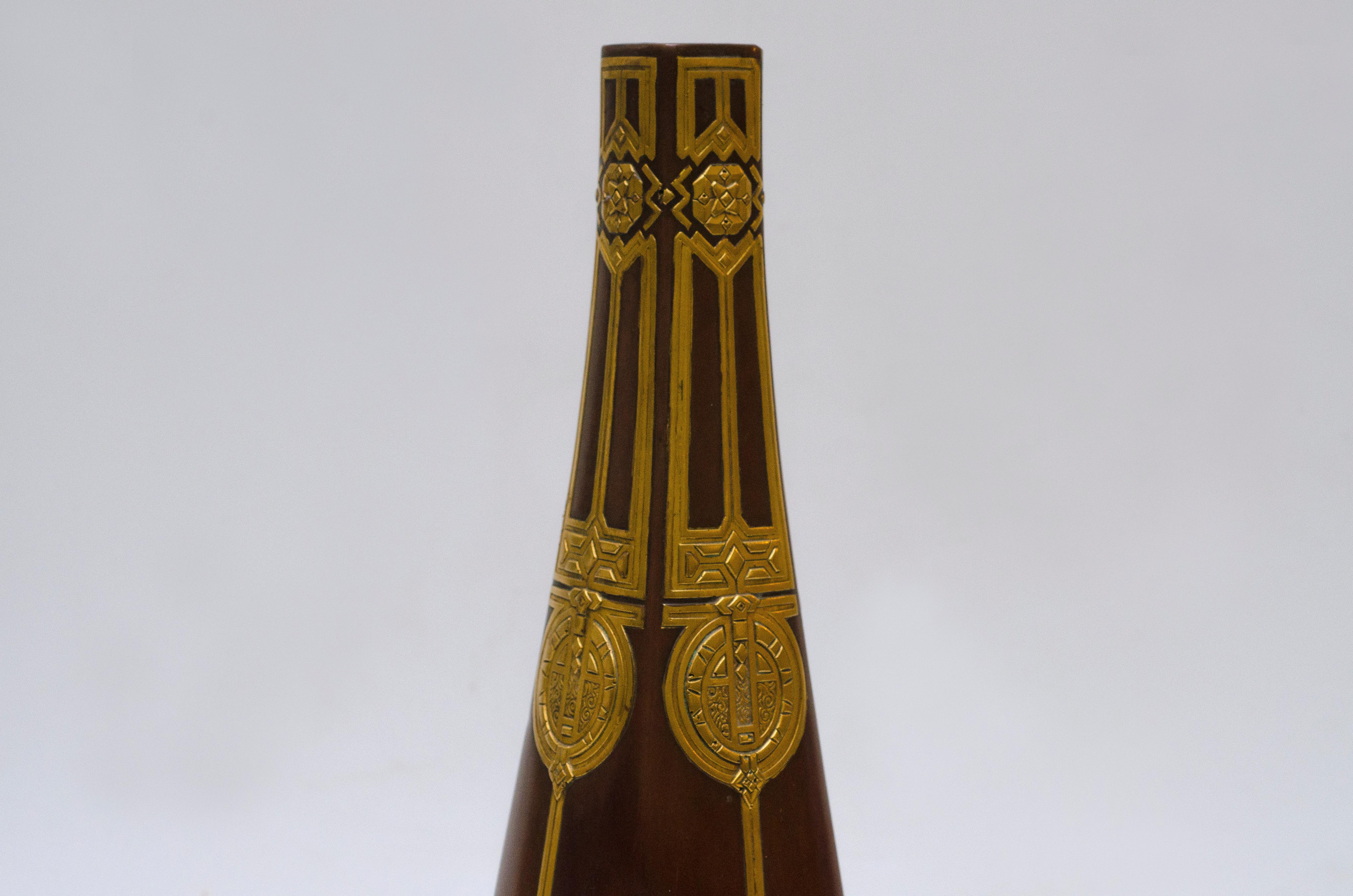Bronze vase by Christlofle. Brown patina and golden details.

Argus Valentine's (2003) 