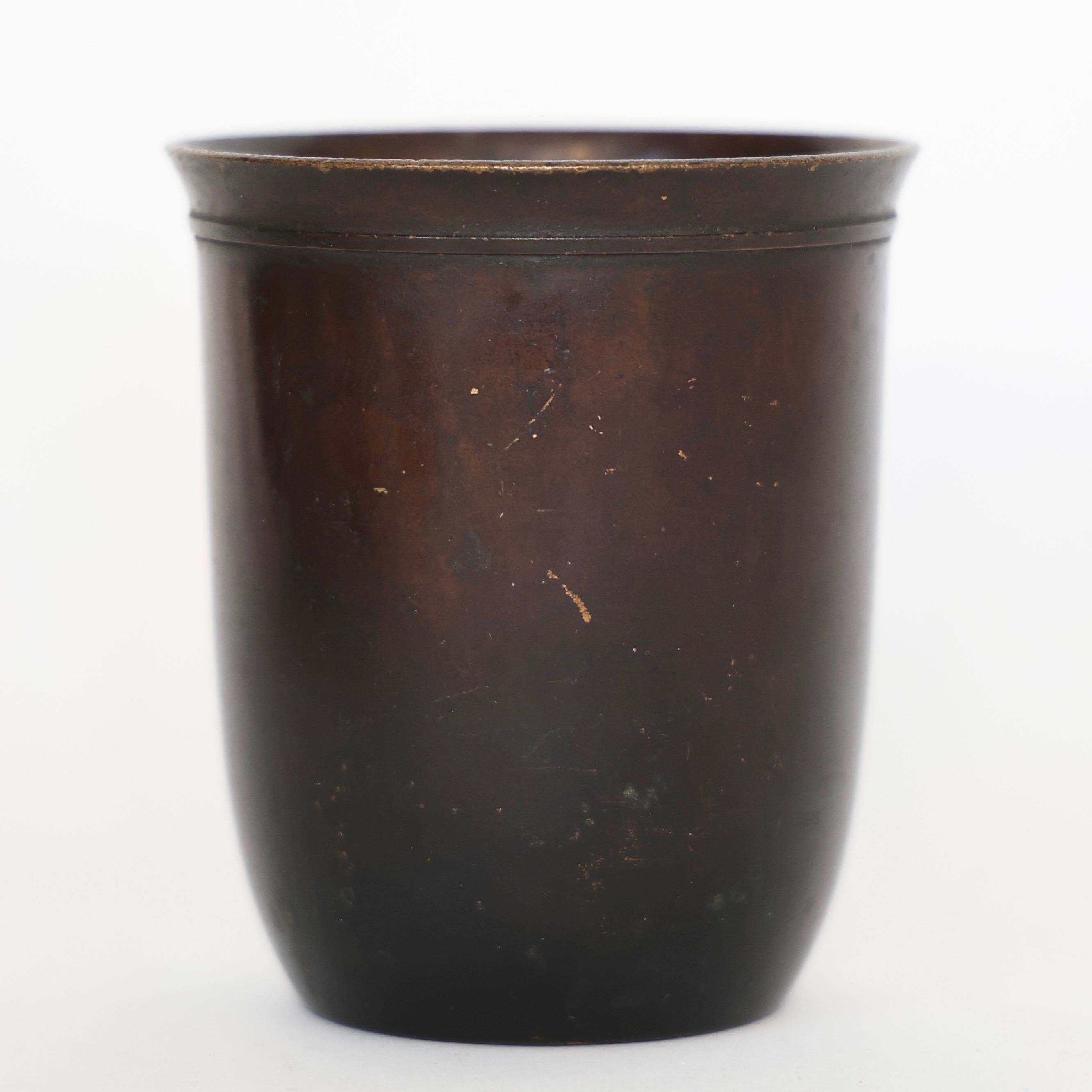 Bronze Vase designed by Just Andersen in the 1920s. A fine piece for a beautiful spot.

* A round bronze vase 
* Designer: Just Andersen
* Model: B70
* Year: 1925-1930
* Condition: Good vintage condition. Makers engravings intact. Lovely patina with