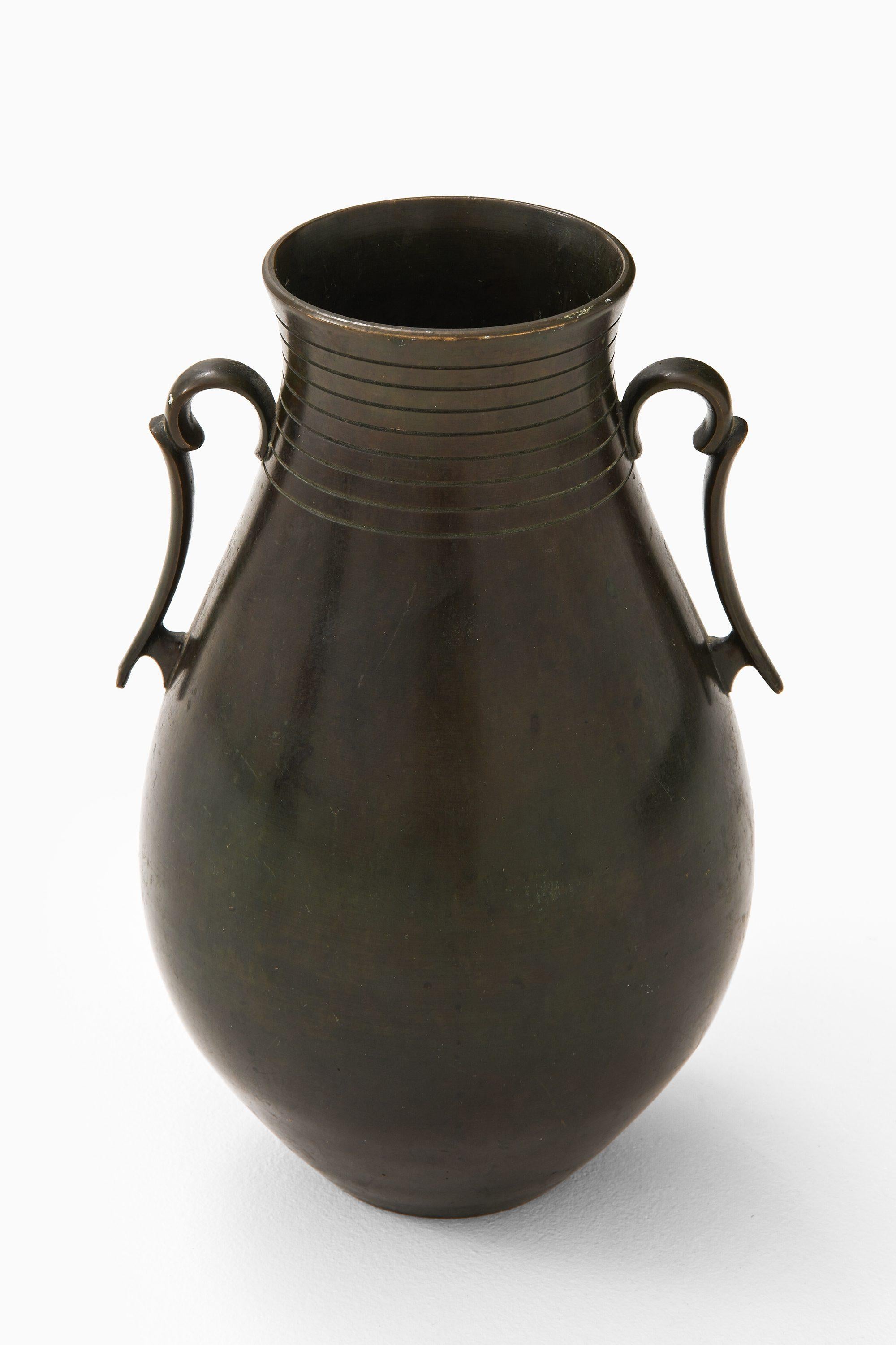 Bronze Vase by Just Andersen, 1950's

Additional Information:
Material: Bronze
Style: Mid century, Scandinavia
Produced by GAB in Sweden
Dimensions (W x D x H): 17x 15.5 x 25 cm