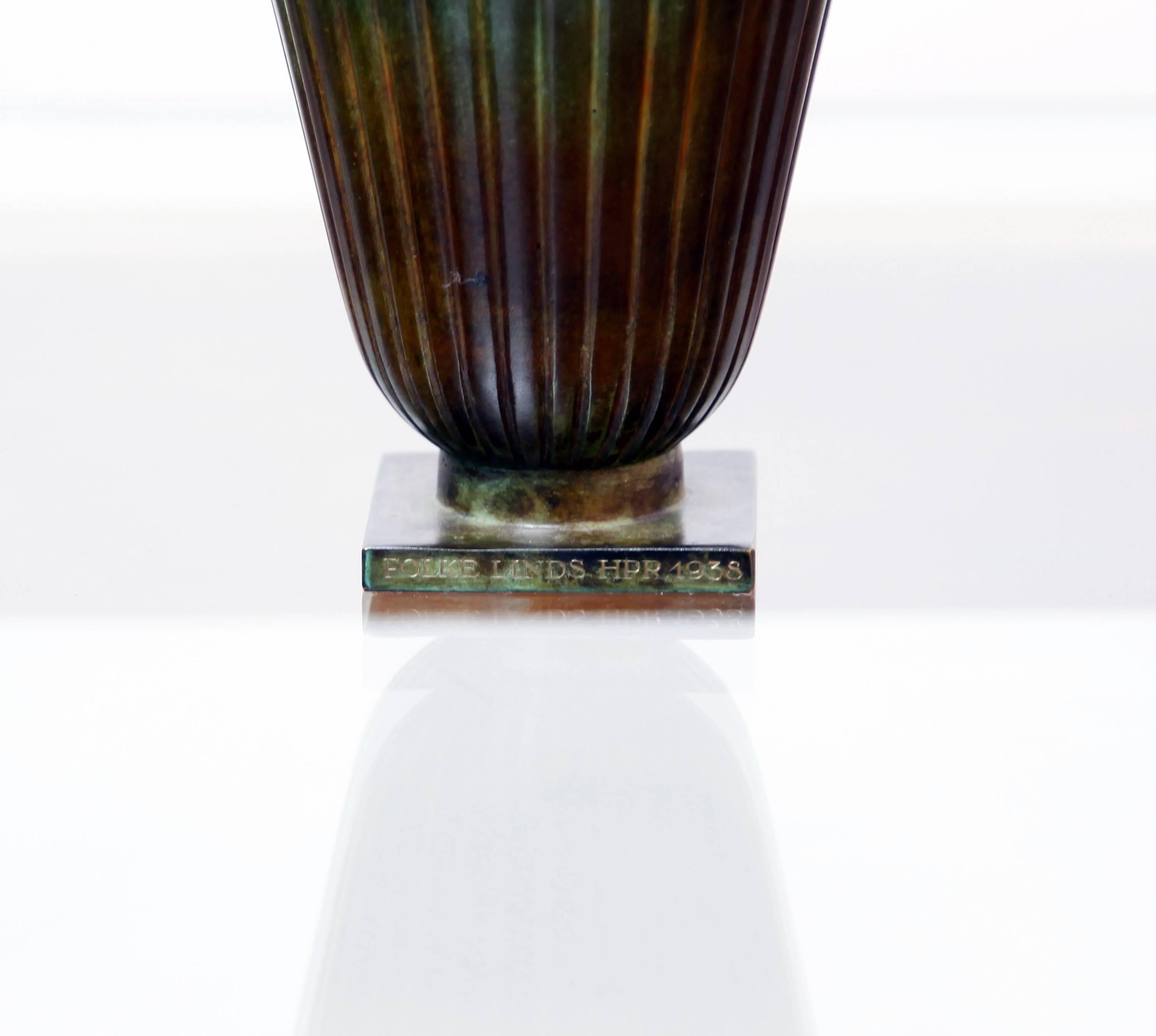 A graceful, patinated bronze vase by the Danish designer Just Andersen for Goldsmedjarnas Aktiebolag (GAB Brons) of Sweden. Andersen was celebrated in his time and has been ever since. His Classic designs remain highly collectible.