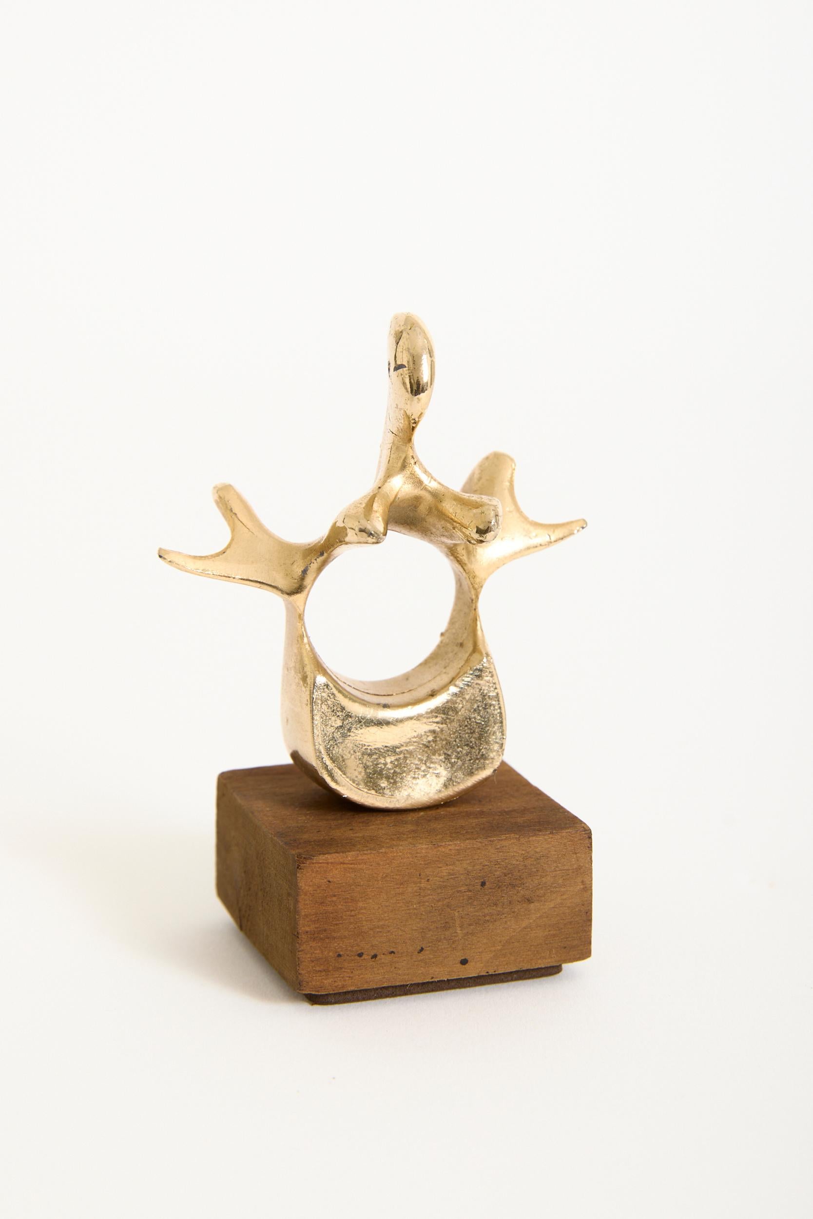 A bronze sculpture of a whale vertebra
France, mid 20th Century
