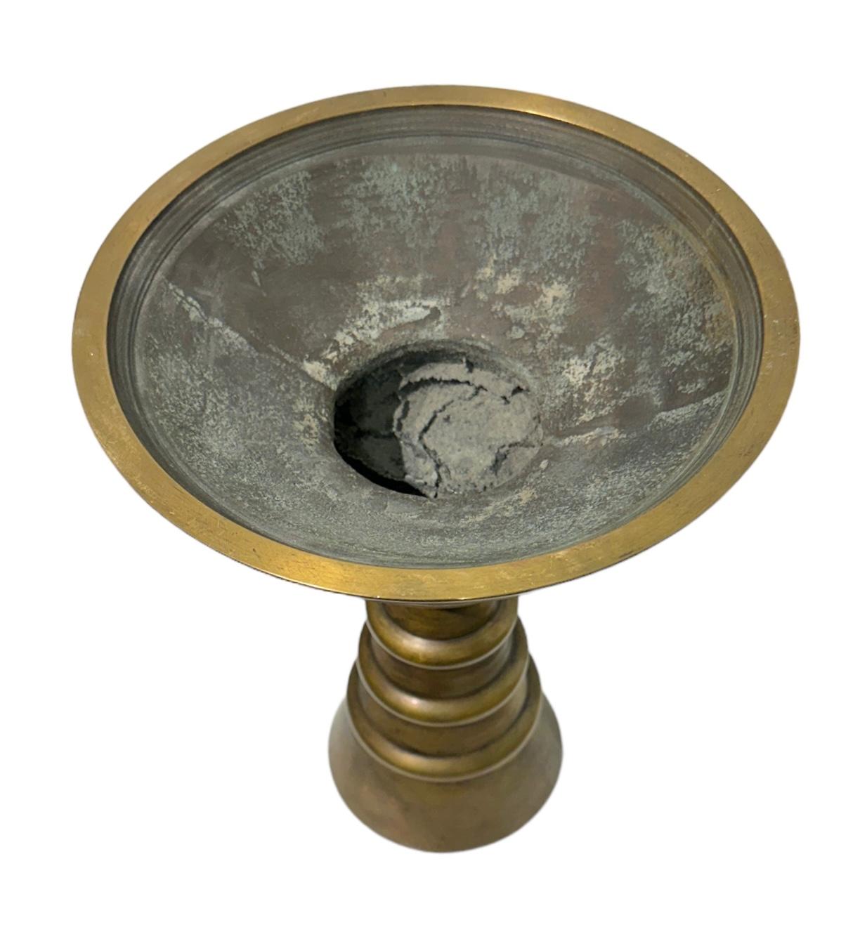 A remarkable example of minimalist design and natural form, this bronze vessel is both beautiful and functional.  This proto-type by designer Raju Peddada is a shift in contemporary decorative furnishings with an interactive design that reaches out