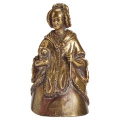 Bronze vintage table bell, depicting an old women with a dog, London, UK 1880.