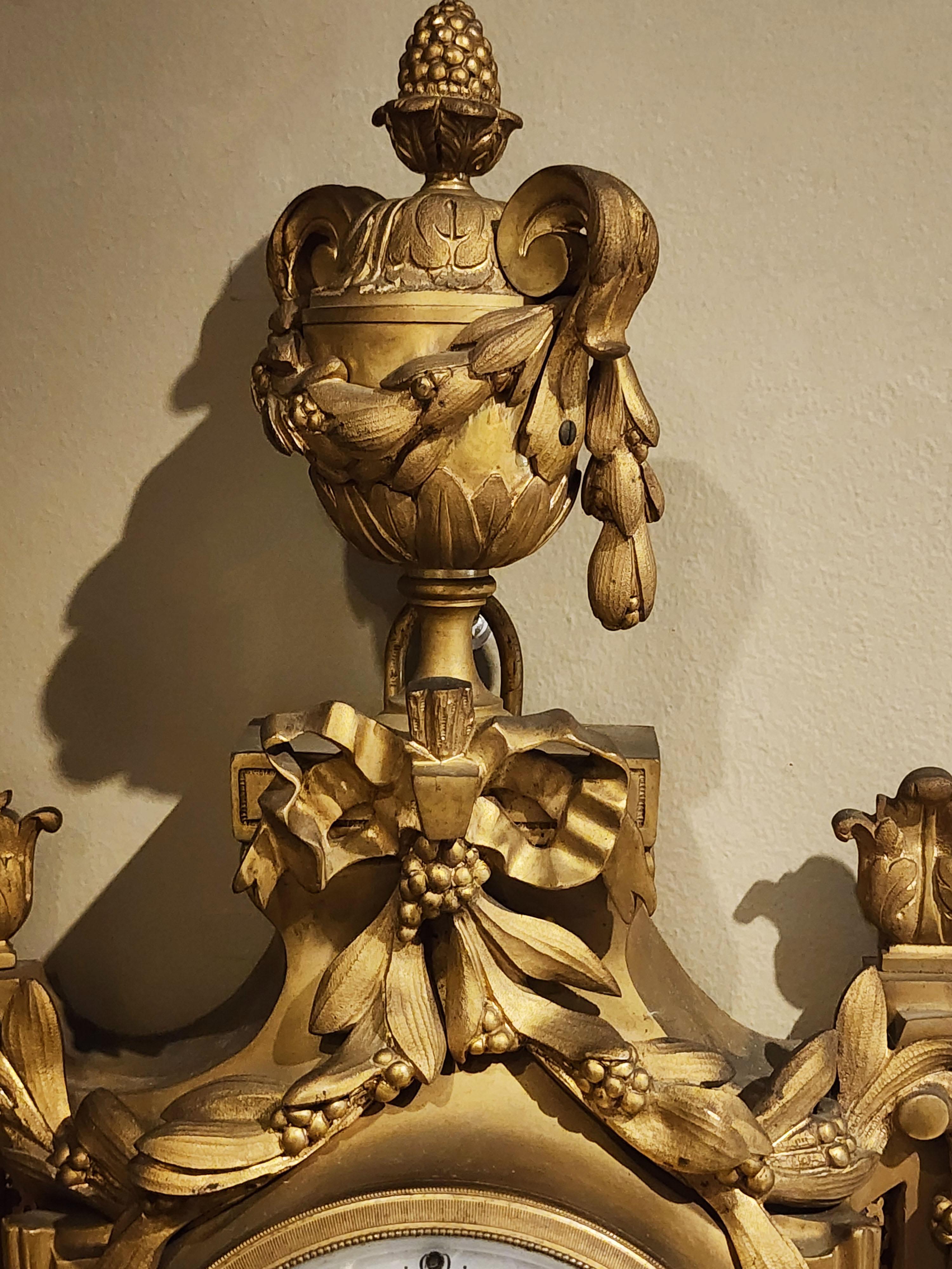 Bronze wall clock, Louis XVI style with a mask For Sale 1