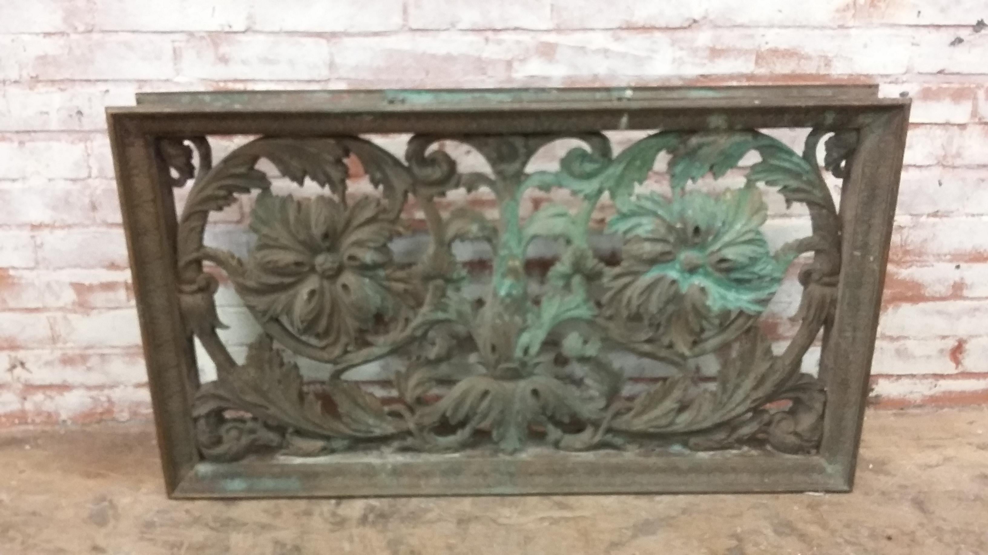 Solid bronze wall panel. Salvaged from a building in New York City. An extremely heavy ornate bronze casting. Possibly from a commercial building. Great natural patina finish. Floral motif.