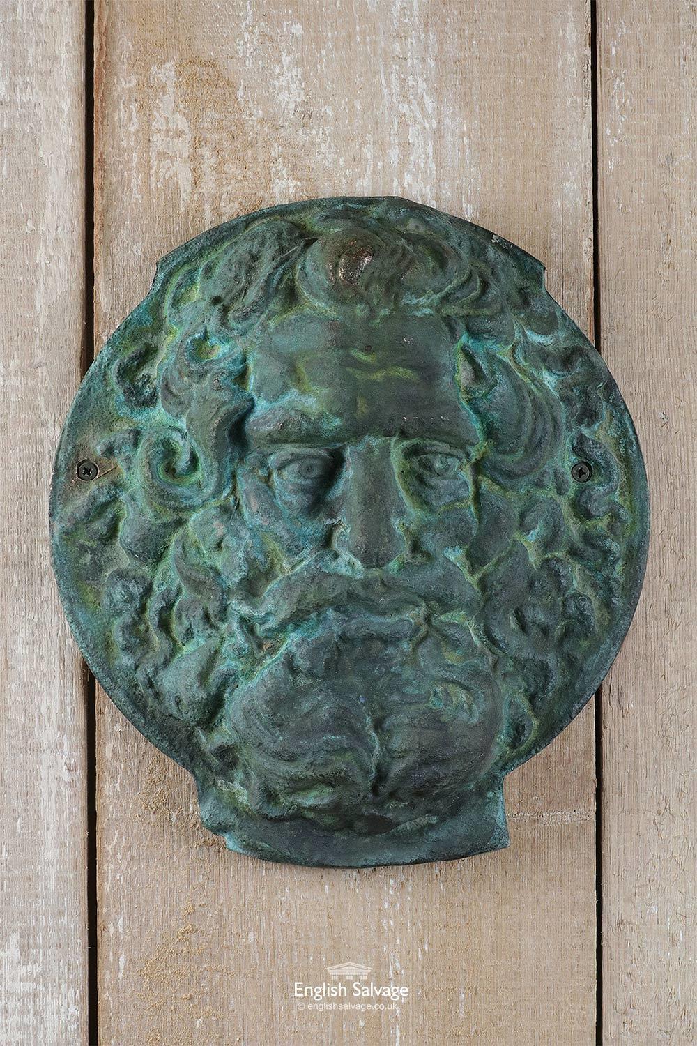 This weighty solid bronze mask or plaque depicting the Greek God, Zeus, has an appealing Verdigris patina. It could serve in any number of ways... as a water feature, or perhaps hung above a doorway...