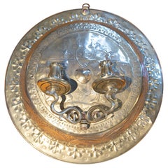 Applique in bronzo con lavorazione in rilievo