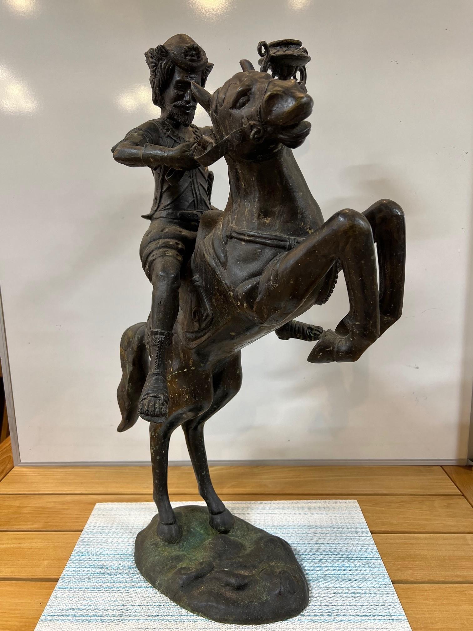 Bronze statue of a rider or warrior on a rearing horse holding a torch. Not sure who the rider is but it's a nice piece. The bronze is in good condition and may have stood on a marble or wood base. The warriors sword is a separate piece that will
